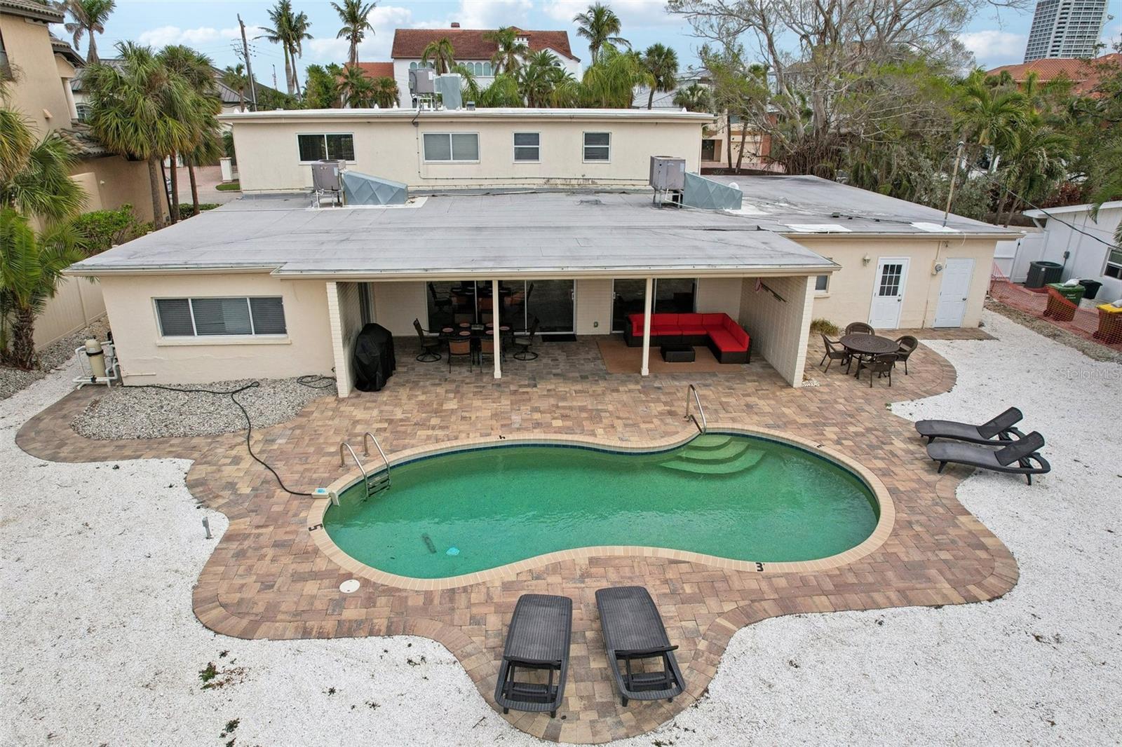 St. Armand's Circle is home to this beautiful turnkey furnished vacation home: a wonderful 2 story, 6 BR, 5.5 BA pool home with ample chef's kitchen, formal dining area, new durable beach sand worthy epoxy flooring. This home is perfect for large family vacation home or to utilize as a successful investment opportunity. This home has been meticulously cared for and enjoyed as a vacation rental for over 10 years and is successful for any investor wanting to cover carrying costs and come visit throughout the year. Just ask for rental history.
The expansive yet comfortable floor plan boasts an eat-in kitchen with breakfast table and breakfast bar. The open concept living room and entertaining area open from sliding glass doors lead to a private backyard oasis featuring an outdoor natural gas heated pool andplenty ofroom to enjoy fun in the sun! Adding to privacy for guests, there is an in-law suite off garage as the 6th bedroom with bathroom and separate exit.
This is the perfect home for a big group to spread out and have your own privacy and space while still allowing for shared memories on the island. A short jaunt out the back gate and you are on St. Armand's Circle - shopping, restaurants, spas, beaches and live music are all around the corner - it doesn't get better than this! At the end of your day you have a private, beautiful place to relax with family and friends.
You can spend the entire day right around the corner at our famous St. Armand's Circle with its award winning indoor or outdoor dining, upscale shopping, and galleries.There is an abundant amount of Activities and Attractions in Sarasota/Bradenton - close by to enjoy many treasures and cultural events. Benderson Park, Mote Marine Aquarium, Ringling Museum of Art, Florida's Largest Wildlife Rescue, Rehabilitation Center with the Pelican Man, Selby Botanical Gardens, Museum of the Circus, water fountain at Island Park, Myakka River and Park, Ed Smith Stadium Sport Complex, Sarasota Ballet (Oct-Apr), Van Wezel Performing Arts, Florida Studio Theatre, Sarasota Opera House, The Asolo Theatre, and Players Theatre. Leisure time can be spent on shops, galleries, golfing, tennis, ice skating, water sports like; fishing, snorkeling, kayaking, diving, jet skis, water skiing or leisure boating or choose from one of our many famous beaches: Siesta Key, Longboat Key, Lido Key, Bradenton Beach, and Anna Maria Beach.