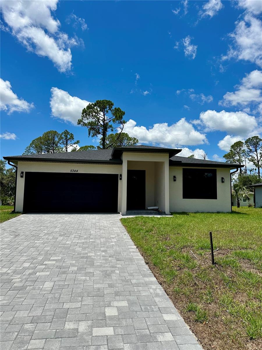 Welcome to your dream home in North Port, Florida! This brand-new, move-in ready home features 3 bedrooms, 2 bathrooms, a versatile den or office, and a 2-car garage. Enjoy a bright, open floor plan with soaring ceilings, luxury vinyl plank flooring, and a chef-worthy kitchen with quartz countertops, stainless steel appliances, a large island, and walk-in pantry. The spacious primary suite offers a walk-in closet and spa-like bathroom with dual vanities and a glass-enclosed shower. Two additional bedrooms provide space for family or guests. Step outside to a private backyard perfect for relaxing. Located in a thriving community near top-rated schools, shopping, dining, parks, and just a short drive to Gulf Coast beaches like Siesta Key and Venice Beach. With easy access to I-75, Sarasota and Fort Myers are within reach. Schedule your private tour today—this stunning home won’t last!