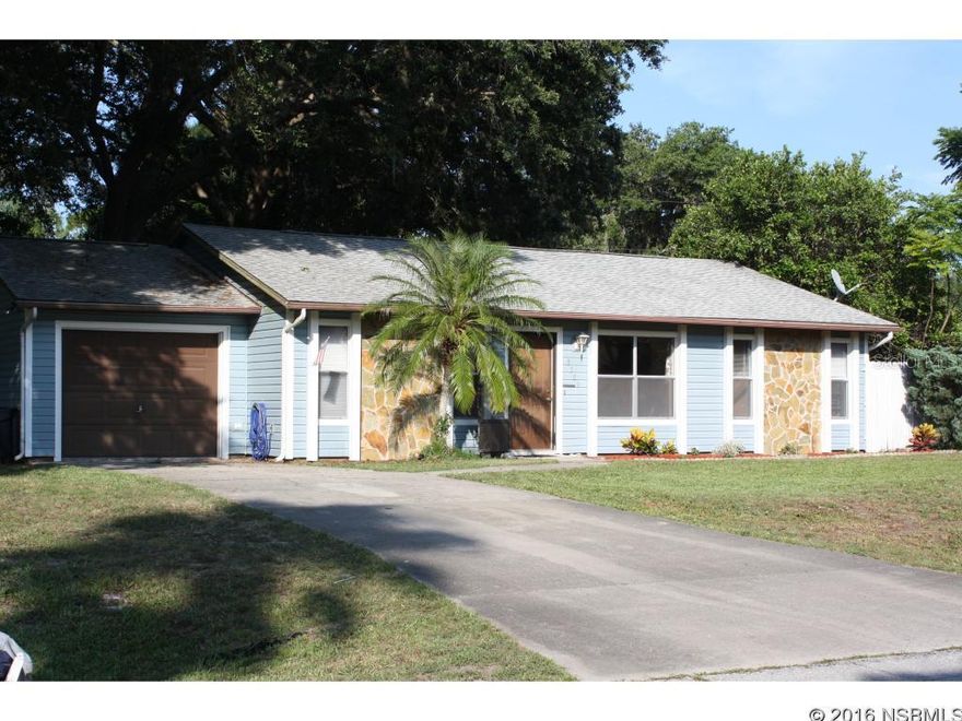 Charming 3 bedroom, 2 bath, 1 car garage home on quiet street in the Florida Shores subdivision. With mature shade trees in the yard, privacy fence, and a large back patio this home is perfect for entertaining or relaxing in solitude. This home features a split bedroom plan, laminate (cherry wood grain) flooring throughout living, dining, kitchen, second and third bedrooms. All stainless steel appliances, breakfast bar, pantry, indoor laundry area and more. ;Water: City