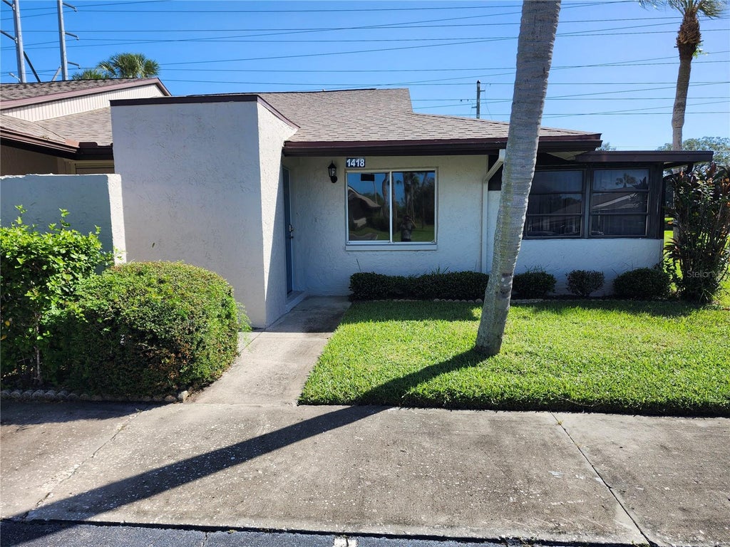 Photo of 1418 14th Circle SE, Largo, FL 33771 (MLS # TB8559464)