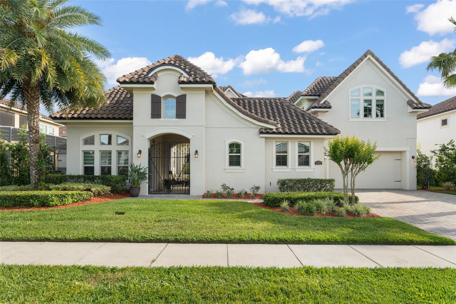 Discover a one-of-a-kind courtyard home with an in-law suite, nestled within the exclusive gated community of Havencrest in Orlando. Offering unparalleled privacy with no rear neighbors, this home is a true sanctuary of tranquility and sophistication, overlooking a serene pond that enhances its breathtaking views. From the moment you enter, you’ll be captivated by the exceptional craftsmanship and designer touches that define this masterpiece. Soaring high ceilings, expansive windows, elegant chandeliers, and abundant natural light create an atmosphere of grandeur and openness. Thoughtfully designed, the home features five spacious bedrooms, including a breathtaking master suite on the ground floor, an elegant home office, and a charming staircase leading to the second floor, where a scenic balcony and an immersive cinema room elevate your living experience. Outside, accordion doors open to your resort-style oasis, featuring a stunning saltwater pool and spa, alongside a fully equipped summer kitchen and gazebo, creating the perfect space for entertaining and relaxation. This home boasts an extensive array of upgrades and is located in one of the few communities in Orlando equipped with natural gas.
Ideally situated near The Grove Plaza and just 30 minutes from Orlando International Airport, this exceptional estate offers the perfect blend of privacy, elegance, and convenience. Don't miss the chance to own one of the best lots in Havencrest! Schedule your private tour today!
