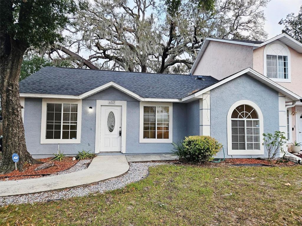 Photo of 6727 Magnolia Pointe Circle, Orlando, FL 32810 (MLS # O6371491)