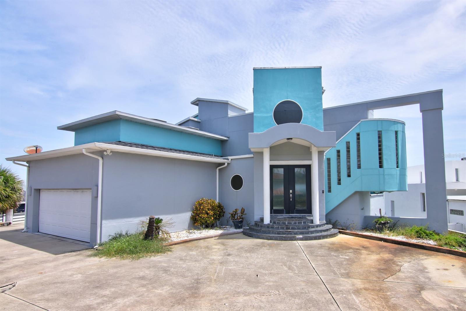 This 6,331 square foot estate spans 2 acres and is truly an architectural masterpiece. From the panoramic ocean views in the common areas to the elegant ocean views from each bedroom, this property offers all who visit an endless beach escape. The large private lot and ideal location allows for a bird’s eye view of all that Ponce Inlet has to offer. From the beach to the inlet and from the dunes to the lighthouse this property has you covered with simply unbeatable scenery. When entering this 4 bedroom, 5 and a half bathroom estate will take your breath away. From the moment you enter the foyer you will never lose sight of the ocean. The segmented floor plan offers unmatched privacy and is ideal for house guests. Moving through the foyer of this 3-story home you enter an elegant great room with attached balcony perfect for hosting formal events or simply taking in the incredible views and enjoying the warmth of the fireplace. Transitioning down to the ocean level you are greeted with a panoramic 2 story wall of windows where a large family room that features an amazing coquina rock fireplace. Adjacent to the family room is a large eat in kitchen featuring a dumb waiter for service to the second-floor formal dining. The enclosed heated pool is just another unique feature allowing for year-round enjoyment. To finish the ground level floor there is a large bedroom with direct pool access and an en-suite bathroom. Back on the main floor there are 2 large bedrooms with private en-suite bathrooms that provide access to a shared balcony overlooking the ocean. Now to the 3rd floor you will follow the beautiful hardwood spiral staircase and walk across the terrace that offers views of the main living area and unmatched views of the ocean to the owner’s quarters. Once in the master suite you will find a spacious estate room with a private balcony with direct ocean views.