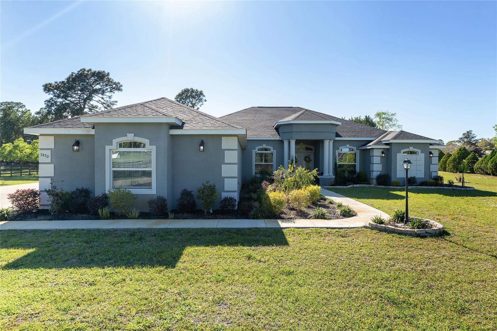 Motivated sellers have reduced the price and are offering $5,000 towards buyer's closing costs!! Nestled in a friendly, quiet, and safe neighborhood, this beautiful home in the gated community of Silver Meadows Central, offers both privacy and comfort. The spacious layout features generous-sized bedrooms, a large kitchen with plenty of storage, separate dining area and breakfast nook as well as a den and an inviting living area filled with natural light from the many windows throughout.
The primary suite boasts a large, bright walk-in closet and a luxurious bathroom with a rainforest shower head plus dual additional shower heads for a spa-like experience. Stylish vinyl plank hardwood flooring runs through all living spaces, adding both elegance and durability.
Enjoy seamless indoor-outdoor living with three access points to the lanai—from the breakfast nook, the living room, and the primary bedroom. The expansive front and back yards provide ample space for relaxation and entertaining, complemented by a water sprinkler system in the front yard.
Practical features include a spacious three-car garage with an attic for extra storage. This home truly offers a blend of comfort, convenience, and charm—don’t miss this opportunity! All sitting on an acre lot with plenty of room for a pool, garden and all your toys!