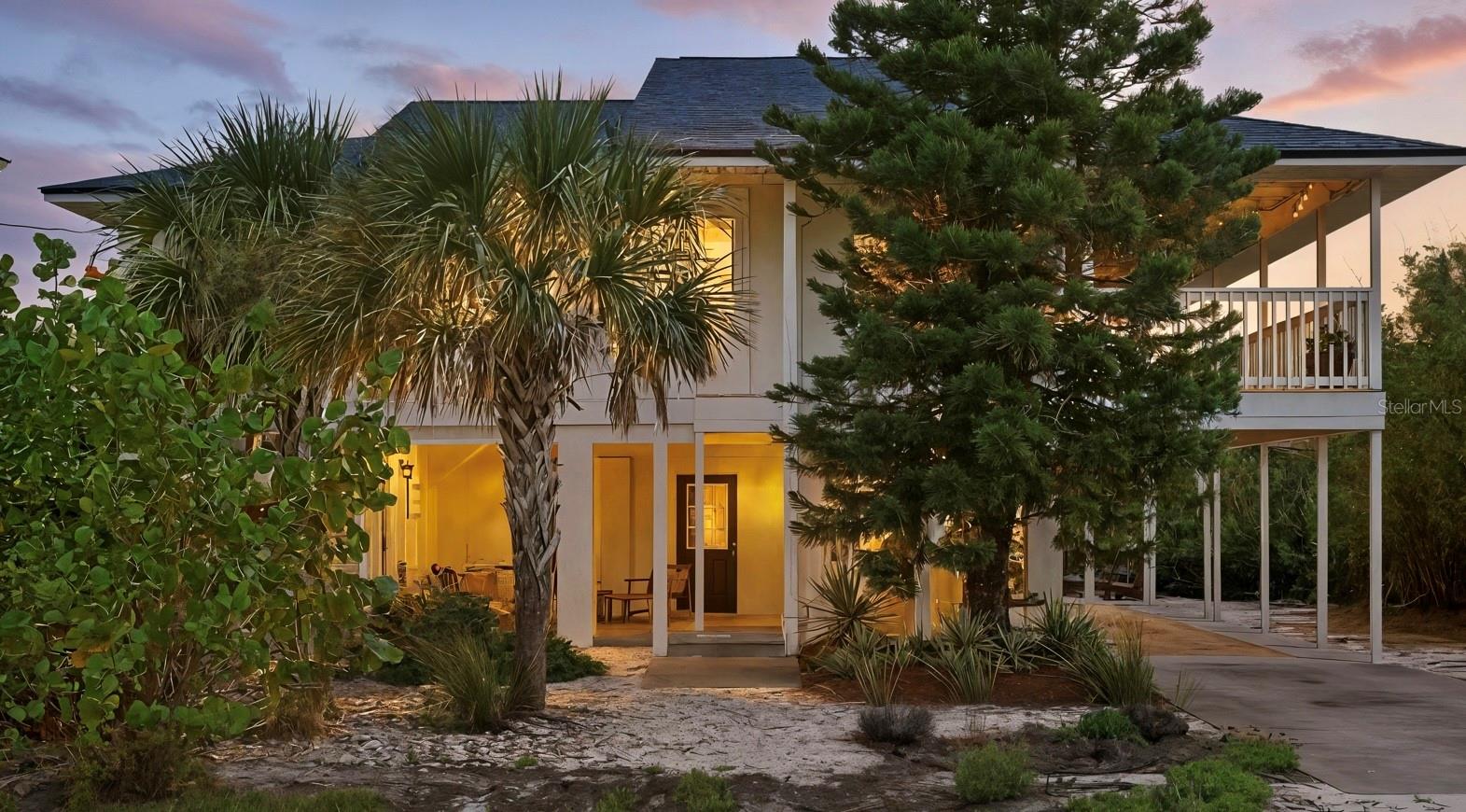 SeaGrape Cottage is a beautifully updated Key West style coastal gem just 300 steps from private community beach walkover. Located in Marineland Acres, this 3 bedroom, 2 bath home is perfect for a family beach retreat or a turnkey investment opportunity, or both! The open concept living blends seamlessly from the oversized outdoor deck which includes a large dining area, to the beautifully refreshed kitchen, indoor dining area and great room. The home is cozy and coastal, but still flows effortlessly for large family gatherings. The upper deck is designed for outdoor entertaining and relaxation, while skylights and large windows fill the home with natural light. Inside, you’ll find designer finishes, custom built-ins, and pottery barn style touches.
Recent upgrades include a new roof (2025), new HVAC (2022), new siding, and reinforced decks. Kitchen includes new SS appliances, open shelving, and solid surface counter-tops.
Low maintainance landscaping and 2 large secured storage areas for beach toys, bikes, and fishing gear. Large backyard with mature landscaping that includes firepit area. No HOA so you have the freedom to maximize rental potential or simply enjoy the beach lifestyle yourself.
Located in close proximity to The Hammock area of Palm Coast, Seagrape Cottage is steps to the beach and close to the Intracoastal Waterway, parks, golf, dining, and shopping. SeaGrape Cottage offers the perfect blend of location, lifestyle, and income potential. Schedule your private showing today!