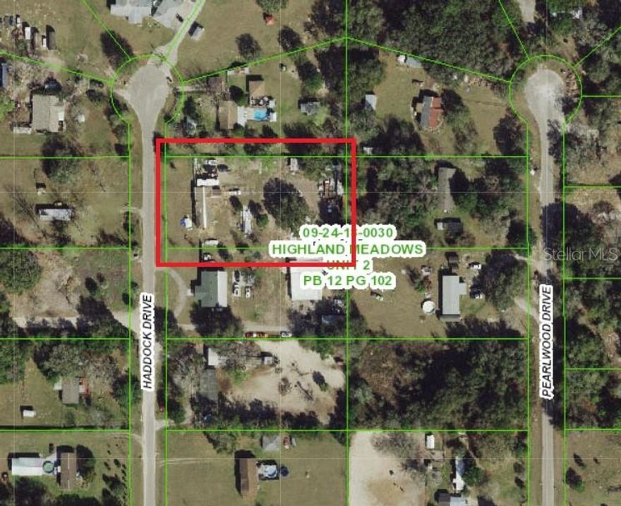 One-acre lot on a paved road, not in a flood zone. Zoned agricultural — bring the horses and animals. Property measures 150 feet wide by 300 feet deep. A mobile home on-site is being removed. No HOA or deed restrictions. Convenient Spring Hill location close to shopping, dining, and main roads. Zoned for horses or up to 3 hooved animals.