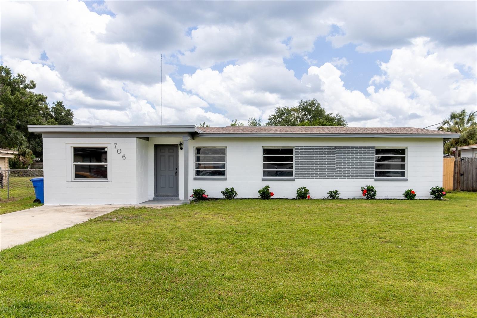 Welcome to Lime Tree, a fully reimagined mid-century ranch located in the heart of Tampa Bay, Florida—where timeless curb appeal meets modern living. This four-bedroom, two-bathroom home has been thoughtfully renovated from top to bottom, with every inch crafted to elevate both comfort and style. The exterior makes a bold first impression with its crisp facade, sharp gray accents, and a beautifully manicured front yard that radiates charm and pride of ownership.
Inside, the transformation is immediately apparent. A brand-new open floor plan creates a seamless flow between the living, dining, and kitchen areas, making the home feel both spacious and inviting. Brand-new flooring stretches throughout the home, paired with modern baseboards, fresh paint, and carefully chosen finishes that give every room a cohesive, polished look. The kitchen is outfitted with new countertops and appliances, offering both form and function for the modern cook. Both bathrooms have been completely redone with sleek fixtures and clean design, turning everyday routines into something a bit more luxurious.
Beyond the obvious upgrades, this home offers perks that are often overlooked but always appreciated—like a dedicated laundry room with ample space for organization and storage. The large front yard isn't just eye-catching; it's functional, offering space for play, landscaping, or future customization. Storage is plentiful throughout the home, adding to its everyday practicality.
Located in the desirable 33619 ZIP code, this home puts you close to the best of Tampa Bay—downtown nightlife, world-class beaches, local parks, and easy highway access—while still offering the peace and quiet of a residential street.
This home isn’t just move-in ready—it’s a home with a fresh identity, built for modern living, and designed to stand out. Homes with this level of finish, functionality, and curb appeal are rare—don’t miss your chance to see it in person.