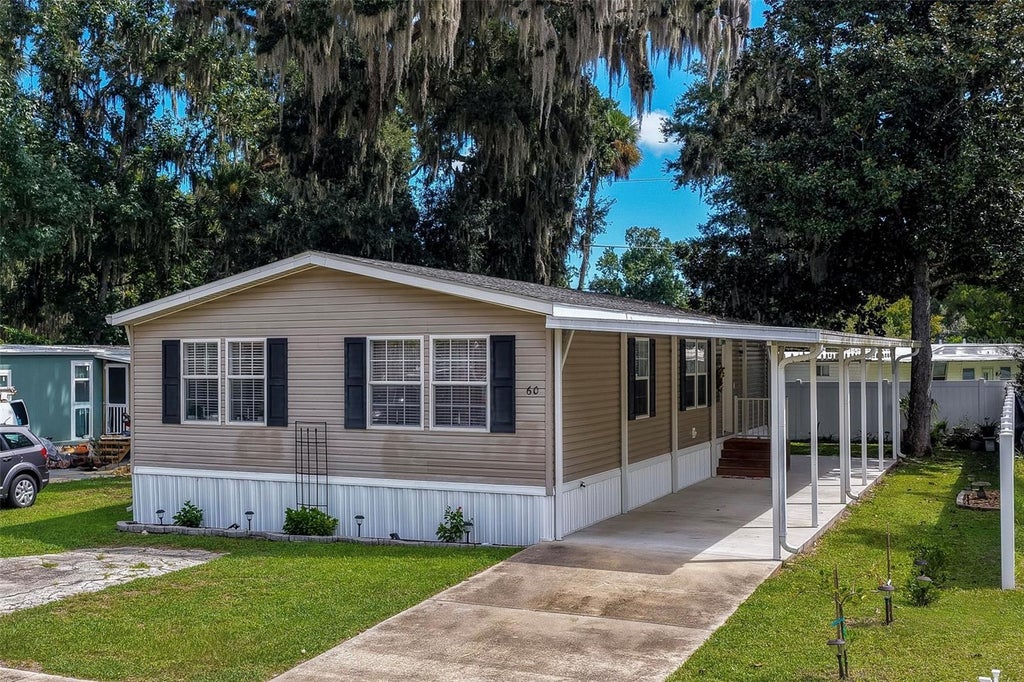 Photo of 60 Golden Gate Circle, Port Orange, FL 32129 (MLS # V4951442)