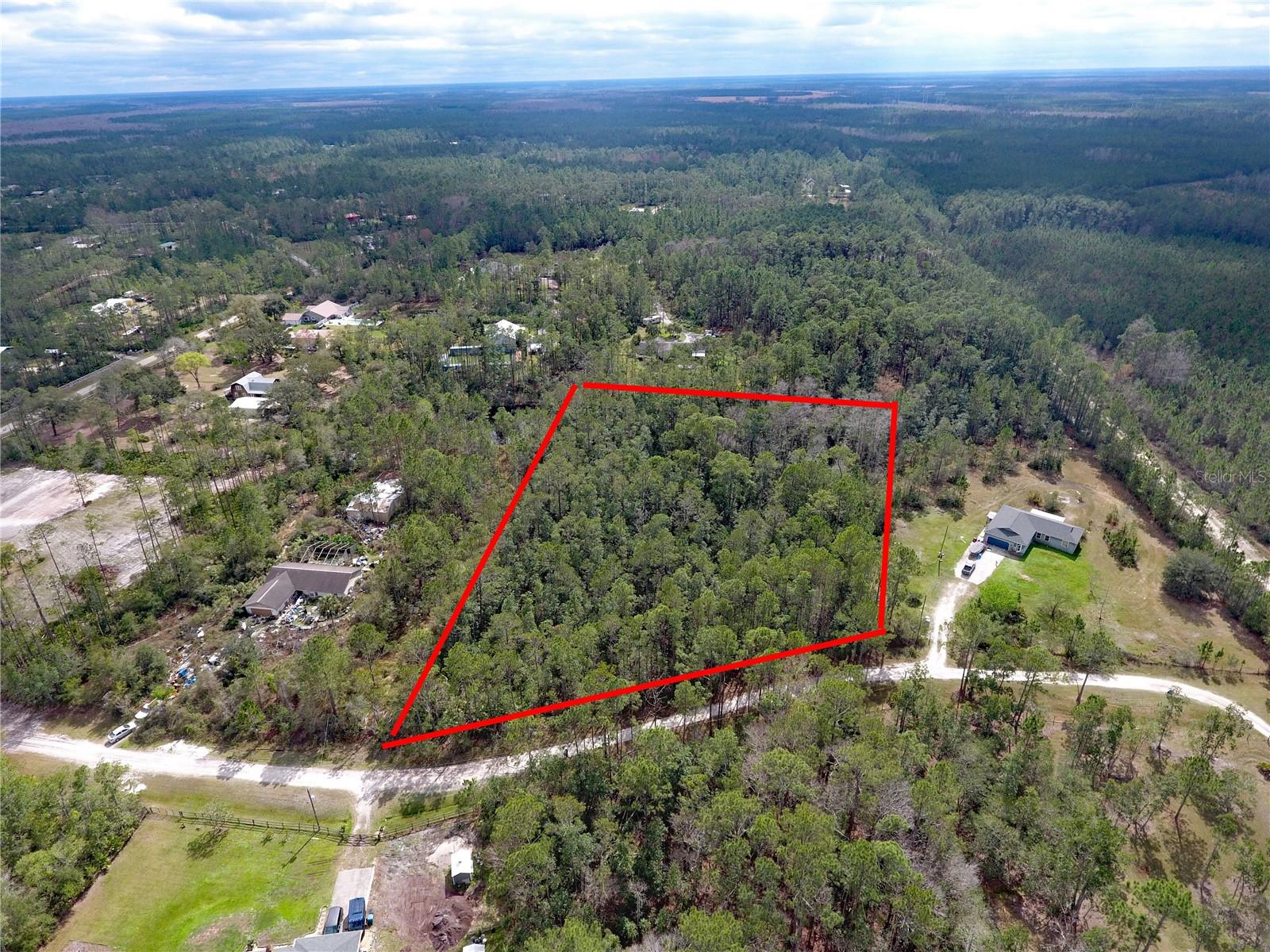 Escape to the serenity of Plantation Pines with this expansive 2.62-acre lot, offering the perfect blend of privacy and natural beauty. Nestled in a peaceful, rural setting, this property provides ample space to build your dream home while embracing the quiet charm of country living. Surrounded by lush landscapes and mature trees, this lot is ideal for those seeking a retreat from the hustle and bustle of city life.
With no HOA restrictions, you have the freedom to design a home that suits your lifestyle, whether it's a spacious estate, a hobby farm, or a private getaway. Zoned for rural residential use, this lot allows for a variety of possibilities. Enjoy the tranquility of Plantation Pines while still having access to essential conveniences within a reasonable drive. Don't miss this opportunity to own a slice of nature in a highly sought-after area of Ormond Beach.