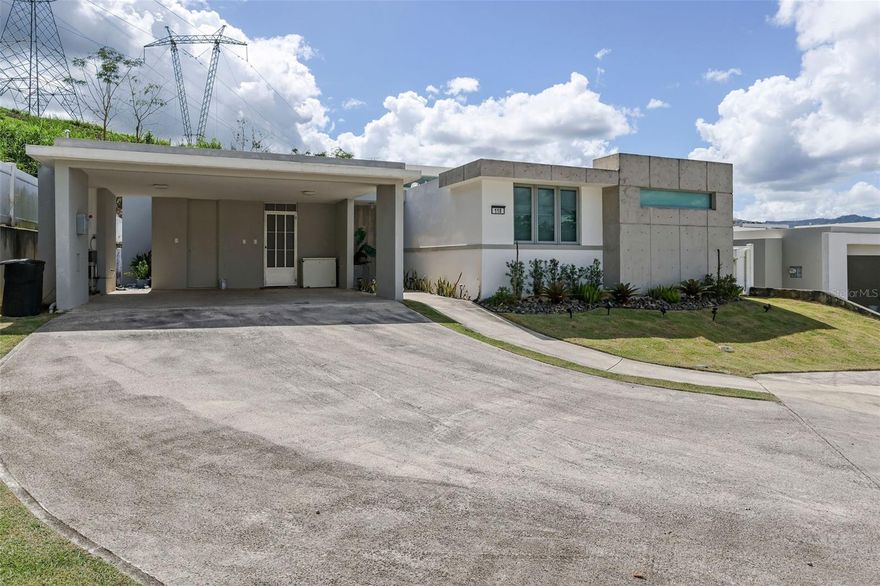 Welcome to your new sanctuary in the heart of Montecielo, one of Guaynabo’s most
desirable gated communities. This single-story residence offers 2,300 sq. ft. of elegant living space, blending modern comfort, functionality, and timeless design. Step inside to discover a bright, open-concept layout that connects the living, dining, and kitchen areas seamlessly.
The home is completely furnished with high-quality décor and ready for immediate move-in. Enjoy outdoor living at its finest with a privately covered terrace and custom bar, perfect for relaxing or entertaining. Located at the end of a peaceful cul-de-sac, the property offers extra privacy and tranquility — ideal for those seeking a premium lifestyle in a secure community.