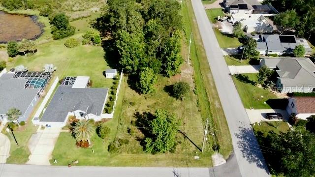 Build your dream home on this spacious corner lot in the sought-after Matanzas Woods community of Palm Coast. This property offers partial lake views and a unique opportunity to design your home to take advantage of the private setting at the rear of the lot. There are no build-time requirements, so you can start your project now or hold onto the lot for future plans. Oversized lots like this are rare in the community. Don't miss out on this exceptional opportunity!