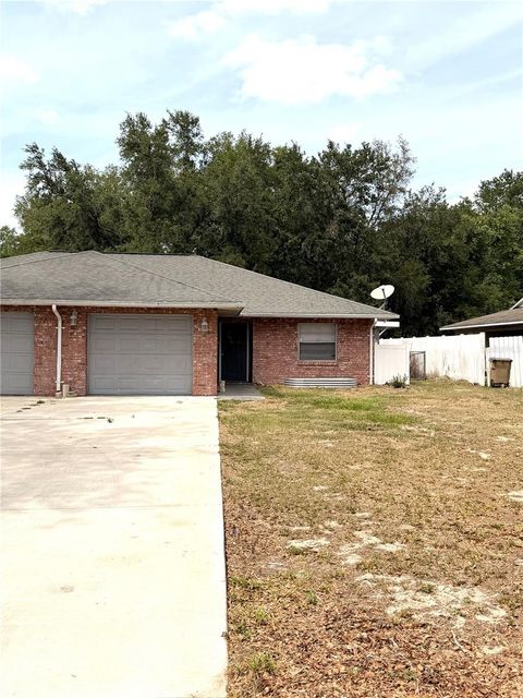 Photo of 2319 Centennial Boulevard, Leesburg, FL 34748 (MLS # G5111286)