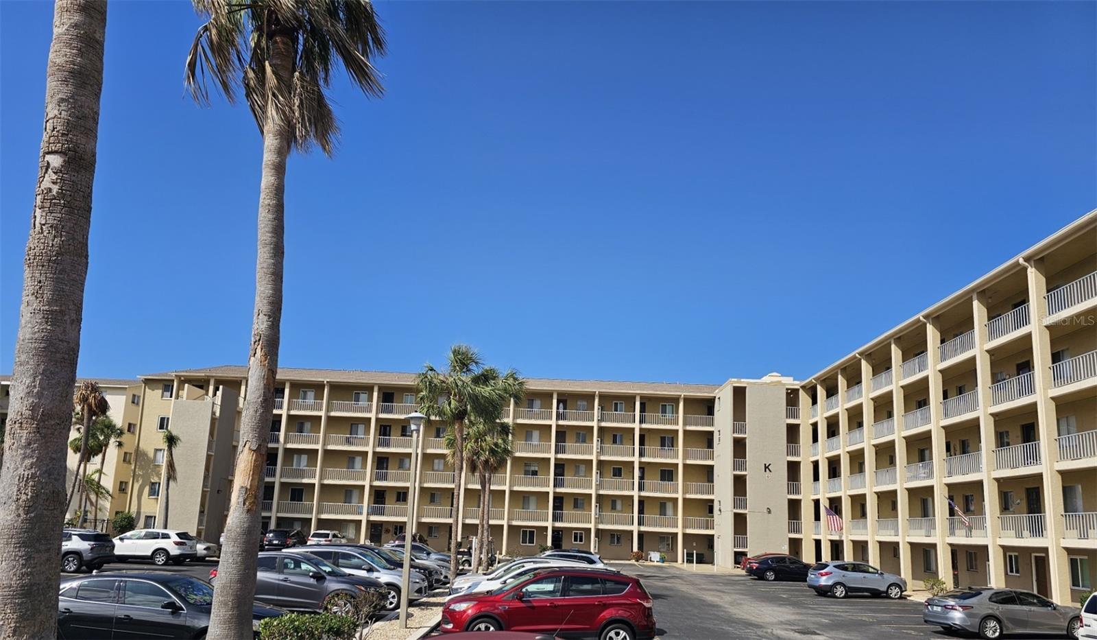 One or more photo(s) has been virtually staged. Spacious 2 bedroom 2 bathroom condo in a 55+ community. Sold TURNKEY FURNISHED, Large living room that opens to bright lanai with storage closet, separate dining area, large master suite with on suite bathroom, walk in closet, access to enclosed lanai. 4th floor unit, NEWER a/c, brand NEW water heater, kitchen has view to dining/living area. This home has great potential to make it your own with great square footage. Not far from shopping, beaches and downtown area. Community offers clubhouse, heated pools, lake, fishing. Location of community is great. Great potential to make your own! Motivated sellers! Large square footage for the price!!!! newer roof completed for building! Some pictures show lots of potential at a great price!