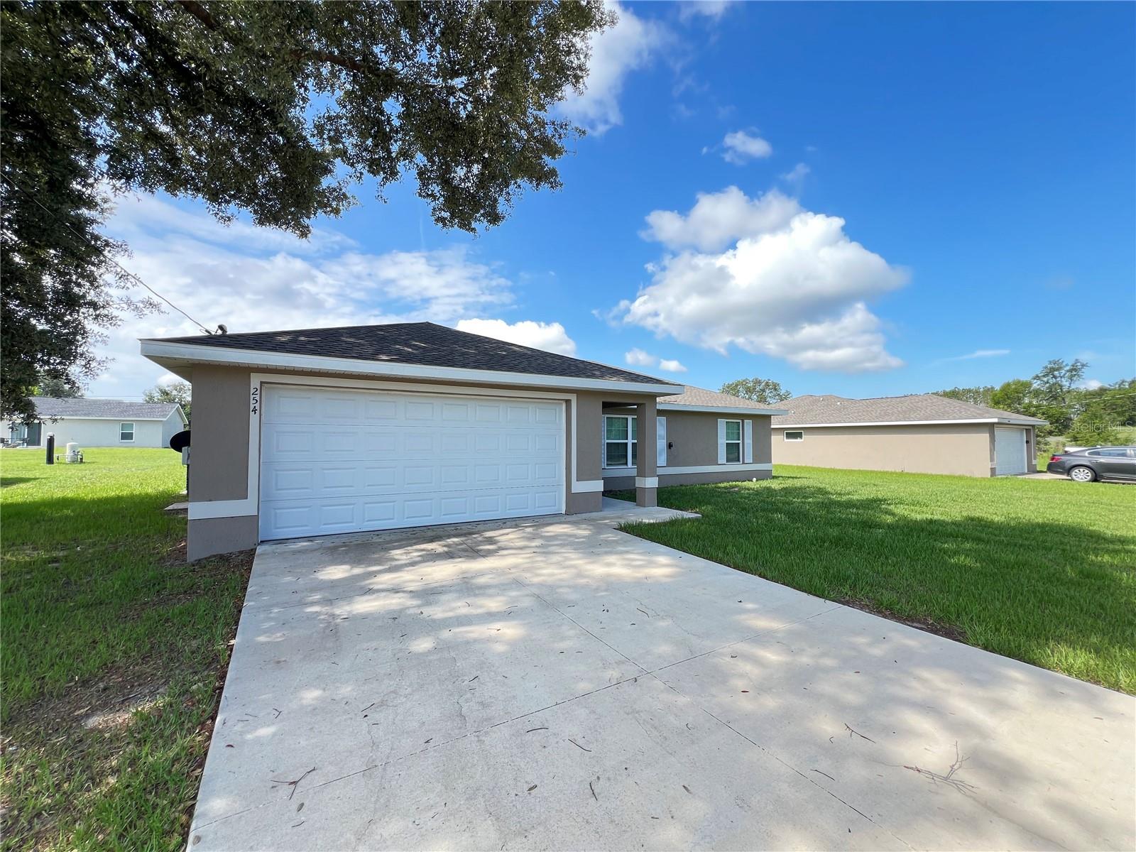 Be the very FIRST to apply for this INCREDIBLE, 3BR/2BA home in the lovely Ocklawaha! This open floor plan features carpet throughout and tile in the wet areas. You're going to appreciate living in a home with High-efficiency windows throughout to save you on utility costs! Beautiful chocolate cabinetry in the kitchen! Automatic garage door opener! Well water, which means no water utility bills!! Near the Ocklawaha Prairie Restoration Area, Carney Island Recreation & Conservation Area & Sunnyhills Restoration Area for the outdoor enthusiasts!! Minutes from E Hwy 25 for easy access! Schedule your showing today because this home is sure to go fast!!
** Well Water & Septic Tank **
Cooling - Central
Heating - Forced air
Appliances Include: Stove, Dishwasher and Refrigerator
The Required, Essential Resident Benefits Package enhances your renting experience for only $34 each month. Tenants enjoy valuable services designed to support your lifestyle and future plans, ensuring convenience and peace of mind throughout your tenancy.