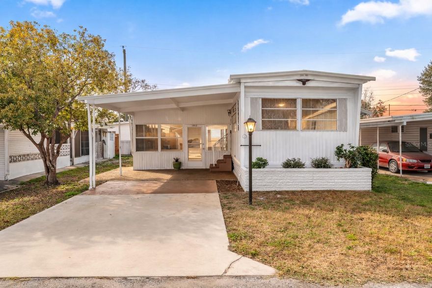 One or more photo(s) has been virtually staged. Welcome to 1012 50th Ave Plz West! Excellent opportunity to purchase this beautifully maintained, 2 bedroom / 1.5 bathroom home in a community with NO HOA, NO age restrictions, and land ownership - no lot rent! This mortgagable manufactured home features a conveniently split floor-plan and has newer light fixtures, creating a clean, updated feel throughout. Brand new luxury laminate flooring enhances the bright living space, while the functional kitchen and spacious layout provide everyday comfort. Bedroom 1 offers two closet spaces for ample storage. Bedroom 2 includes a closet/utility area with an attached half bath, adding flexibility and convenience.  Ideally located near popular restaurants, beautiful Gulf beaches, and Sarasota International Airport, this home would be perfect as a primary residence, snowbird getaway, or investment opportunity!