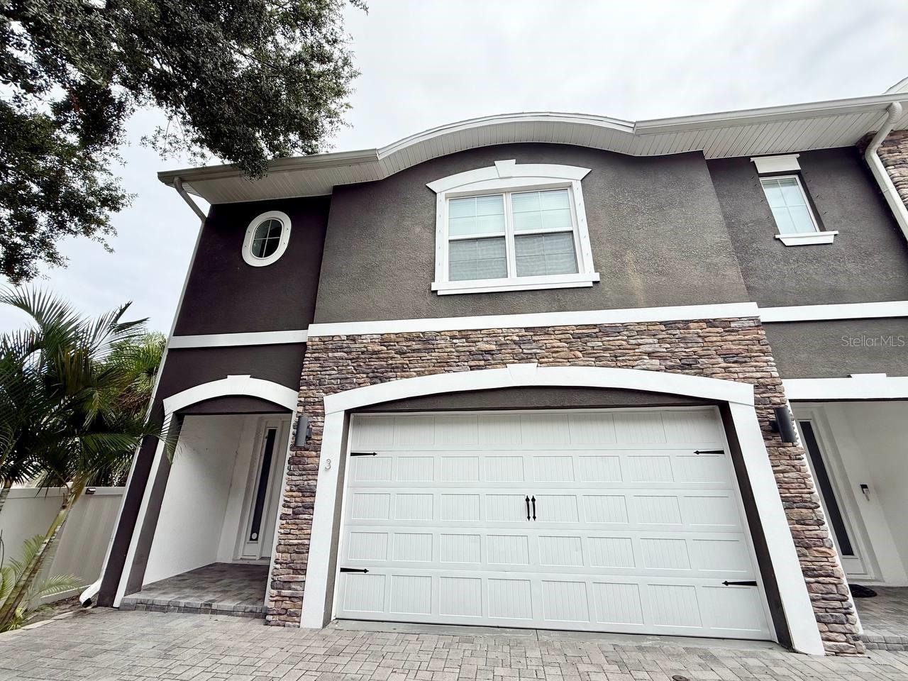 Discover a hidden gem in South Tampa with this updated 3-bedroom, 2.5-bathroom townhouse that provides ample space for comfortable living. Located with easy access to MacDill Air Force Base, Downtown Tampa, Tampa International Airport, Downtown St. Pete, and the stunning Gulf Beaches, this home is perfectly situated for both convenience and lifestyle. Brand new paint and carpet are already in place just add your distinctive touch to make it your own. Enjoy the benefits of an attached 2-car garage, keeping your vehicles sheltered from the elements. The homes soaring ceilings, crown molding, and warm laminate wood floors create a welcoming atmosphere throughout. The open concept living area is perfect for entertaining, with the kitchen at the heart of it all. Featuring sleek granite countertops, soft-close shaker cabinets, and stainless-steel appliances, it is both functional and stylish. The breakfast bar seamlessly connects the kitchen to the dining and living areas, adding a touch of sophistication and convenience. The spacious primary bedroom is a true retreat, complete with a coffered ceiling for added elegance. The primary bathroom offers dual sinks and an impressive 8' x 10' walk-in closet, bathed in natural light from a window. Additional amazing amenities include a ring doorbell camera, smart app washer and dryer along with oversized laundry room with tons of cabinetry. In addition to the advertised base rent, all residents are enrolled in the Resident Benefits Package (RBP) for $50.00/month which includes HVAC air filter delivery, credit building to help boost your credit score with timely rent payments, utility concierge service making utility connection a breeze during your move-in, and much more! More details upon application. Lawn, water, trash, and sewer are all included in rent. Vacant and Available now