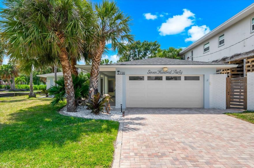 "Timeless Beach Vibe" - Welcome to this beautifully remodeled, TURN-KEY READY home in the desirable North Beach Neighborhood. Located within close proximity of the sparkling sand of Clearwater Beach, this incredible property has been reimagined for entertainment and relaxation. The light and bright palette welcomes you when you walk in the door. This 3 bedroom, 3 bathroom home with an attached 2 car garage has over 1,700+ square feet of living space and includes all the bells and whistles you could ask for. The grand kitchen features a stunning waterfall edge island with dramatic lighting detail and a crisp blue and white palette, anchoring the open floor plan on one side of the house while offering ample storage and counter space. The kitchen features all new appliances, and the back kitchen comes with additional features including an ice-maker, mini-refrigerator, microwave coffee bar, and an indoor washer dryer setup for easy in and out beach access. Floating shelves on the custom backsplash enhance the subtle beach vibe and decoration. The living and dining areas open to covered private outdoor living space, which offers views of the rear yard with mature landscaping and large amount of room for a pool. The primary bedroom offers a private retreat and features a luxurious en-suite bathroom with custom tile work, including a “wet” room with a soaking tub and shower. The bedroom also offers dual closets including a walk-in closet as well as easy access to the outdoor area to enjoy a morning sunrise cup of coffee. The two additional bedrooms are ideally sized, offering ample closet and storage space and share a hallway bathroom with a stand-up shower and custom tile work. Updates in recent years include a new roof, a tankless water heater, new HVAC, impact windows, paver driveway, new electrical panel, luxury vinyl flooring throughout, and both interior and exterior paint. This home is an ideal location for either a short walk or drive to a plethora of exciting restaurants, and bars, and coffee shops. Get ready to escape to your beach paradise and come see this home today!