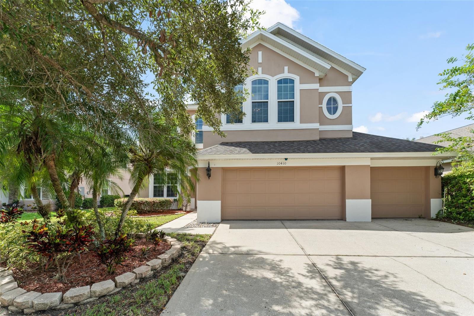 **This house comes with a REDUCED RATE through the seller's preferred lender. This is a lender-paid rate buydown that reduces the buyer's interest rate and monthly payment.** Step into nearly 3,050 square feet of thoughtfully designed living space in this stunning 4-bedroom, 2.5-bathroom pool home, complete with a 3-car garage and an inviting layout that’s perfect for both everyday living and memorable entertaining. As you enter, you're immediately greeted by soaring ceilings and an elegant view of the formal living and dining rooms, where natural light dances across the space. Your eyes are drawn upward to the loft above, with a beautiful railing that adds architectural character and overlooks the welcoming foyer. Just past the staircase, the home opens into a cozy family room with beautiful wood flooring, where French doors lead out to the serene backyard oasis. To the right, a hallway leads you to a spacious laundry room, a conveniently located half bathroom, and access to the three-car garage, making daily routines a breeze. The kitchen is the heart of this home, featuring warm-toned cabinets with crown molding, a built-in wine rack, rich stone countertops, and a charming breakfast nook with bonus cabinetry for extra storage. It’s the perfect space to cook, connect, and create memories—and comes equipped with newer appliances that blend style with modern convenience. Upstairs, plush carpeting guides you through the second floor, where you’ll find two comfortable bedrooms, both with built-in closets—and Bedroom 2 features a spacious walk-in closet, offering excellent storage. A full bathroom with a tub-shower combo sits conveniently between them. At the end of the hall, retreat to the spacious primary suite, complete with a luxurious en-suite bathroom. Here you’ll enjoy dual vanities with a seating area, a glass-enclosed walk-in shower, a jetted soaking tub, and a large walk-in closet—your own private sanctuary. Also upstairs is the fourth bedroom and an open loft area, currently used as a sitting room. The loft adds flexibility to the floor plan and offers a lovely view down to the front entry, bringing a sense of openness and connection throughout the home. This property is not only beautiful but also thoughtfully upgraded with energy-efficient windows, a new AC system, and the peace of mind that comes with modern, updated appliances—making it as efficient as it is elegant. Step outside and you'll fall in love with the fully fenced backyard—a peaceful escape with a paved patio, sparkling pool, and a grassy area perfect for pets or play. Whether you're sipping morning coffee poolside or hosting weekend barbecues, this outdoor space is your personal slice of Florida paradise. Located in a friendly neighborhood in East Orlando, this home is more than just a place to live—it’s where memories are made, laughter is shared, and life unfolds beautifully. Come experience the warmth and charm of 10410 Stone Glen Drive... a home that truly has it all.