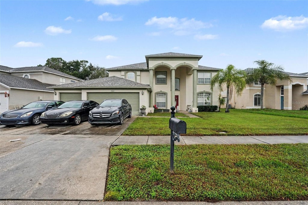 Photo of 27021 Coral Springs Drive, Wesley Chapel, FL 33544 (MLS # TB8559965)
