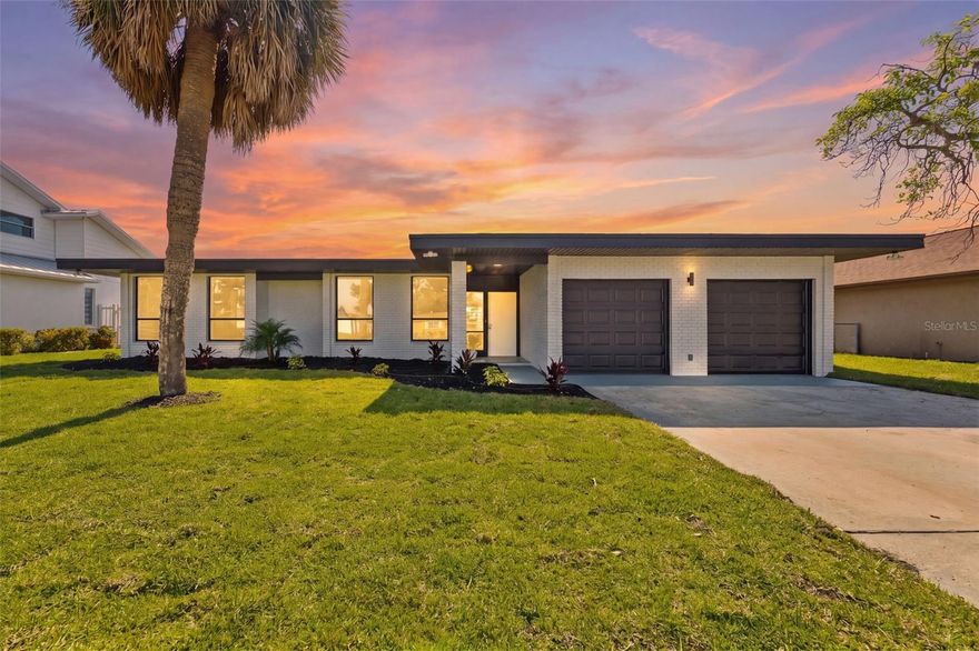 Experience turn-key waterfront living in this beautifully renovated Dana Shores home, where sweeping water views and coastal elegance define every space. This beautifully renovated home at 3917 E Eden Roc Circle showcases stunning water views, modern upgrades, and a thoughtfully redesigned layout ideal for both everyday living and entertaining.

Step into a spacious foyer that opens to a bright, open floor plan with a relaxed coastal feel. Enjoy water views from every room along the back of the home, creating a serene and picturesque backdrop throughout the main living spaces. The stylish kitchen features striking blue cabinetry, sleek quartz countertops, new appliances, and easy access to a convenient wet bar complete with a drink fridge—perfect for hosting.

The expansive primary suite is a true retreat, offering an oversized walk-in closet and a luxurious ensuite bath with dual sinks, a soaking tub, separate shower, and breathtaking floor-to-ceiling water views. The dining room also captures the beauty of the waterfront with dramatic floor-to-ceiling windows.

The spacious family room is filled with character, highlighted by rustic wood ceiling beams, and features sliding glass doors that open wide to let in the refreshing sea air—creating a true indoor-outdoor living experience. Just beyond, the screened-in patio offers the perfect setting for bug-free alfresco dining while enjoying tranquil water views. A convenient pass-through bar connects the patio to the interior wet bar, making entertaining effortless.

Outside, the property features an upgraded seawall and offers ample room to add a future pool, dock, and boat lift—making it a boater’s dream. From this location, enjoy easy access by boat to Tampa Bay, nearby waterfront restaurants, downtown Tampa, and popular destinations like Armature Works.

Additional upgrades include new interior and exterior paint, a new HVAC system, new hot water heater, and a roof installed in 2016. A two-car garage with laundry hookups and an extra-large hall closet with under-air storage add convenience and functionality.

Ideally located just minutes from Old Memorial Golf Club, walkable to nearby park with playground, ball fields and courts. 5 minutes to Tampa International Airport, International Mall, and Berkley Preparatory School. 15 minutes to downtown Tampa.

Move-in ready and filled with designer touches, this exceptional waterfront home combines modern comfort, coastal style, and incredible potential in one of Tampa’s premier waterfront communities.