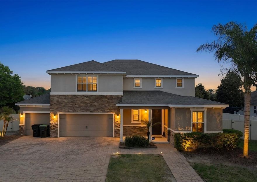 One or more photo(s) has been virtually staged. Welcome to your Florida Paradise—where luxury meets lifestyle. Perfectly positioned on one of the most desirable oversized lots in the community, this exceptional home offers serene pond views with no rear neighbors, giving you the privacy and peaceful backdrop you’ve been searching for.

Step outside and experience a true resort-style retreat. The backyard is designed to impress, featuring a custom cabana with built-in outdoor grill, a multi-zone speaker system, and a covered patio with mounted flat-screen TV—perfect for entertaining or unwinding. The stunning pool showcases elegant stonework, a pebble finish, and dramatic fire features that elevate every evening into an experience. The fully fenced yard is beautifully framed with lush queen palms, creating your own private oasis.

Inside, every detail reflects thoughtful upgrades and timeless design. Enjoy rich wood flooring, custom wainscoting, and an abundance of natural and ambient light. The kitchen is both stylish and functional, offering granite countertops, stainless steel appliances, and modern finishes. The home also features plantation shutters, LED lighting, and a built-in speaker system throughout the main living areas and primary suite. The spa-like primary bathroom includes a frameless glass shower, adding a touch of everyday luxury.

With 5 bedrooms, 4.5 bathrooms, and a spacious 3-car garage, this home offers both comfort and flexibility for modern living.

Your Home, Your Castle—schedule your private showing today.