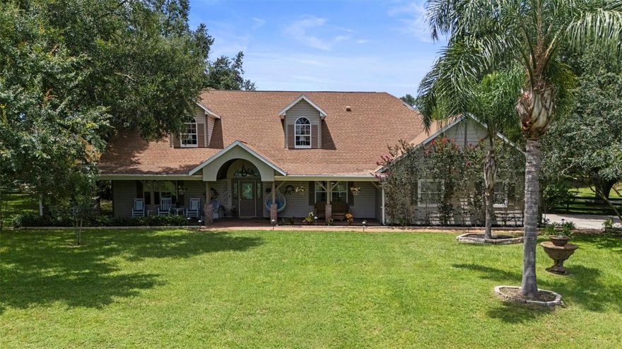 Welcome to your private retreat nestled on almost two and a half acres of serene landscape. This exceptional 4-bedroom home offers the perfect blend of comfort, elegance, and versatility, ideal for those seeking space to live, work, and entertain.  

Step inside to discover soaring cathedral ceilings and gorgeous real wood flooring on the main level. The second floor boasts a wide-open loft space with two separate sitting areas. With three of the four bedrooms featuring en-suite bathrooms, there's no shortage of
privacy and convenience for family or guests.  The front of the home features a beautiful covered porch where you can relax and enjoy the peace and quite of your new neighborhood.  Enjoy even more peace of mind in knowing that you have a BRAND NEW ROOF and BRAND NEW WATER HEATER.

The heart of the home opens to a beautifully designed screened-in patio, complete with a heated pool and spa — perfect for relaxing evenings or lively gatherings, all while enjoying Florida’s sunshine without the bugs. Watch the ball game or your favorite movie from the pool, and enjoy music with the patio's surround system.  Built-in misters help keep the party going by keeping everyone cool and refreshed.

But the true standout lies just beyond the home: a massive 50’ x 52’ barn/garage with enough clearance to accommodate an RV — a rare and valuable feature. Whether you're a car enthusiast, business owner, or simply need substantial storage, this space delivers. It has even been leased to businesses in the past as a workshop, creating an incomegenerating opportunity. Attached to the garage is a 12’ x 36’ office building with A/C, offering a seamless work-from-home or small business setup without sacrificing your personal living space. 

The expansive lot is completely board-fenced, so bring a horse or two!  When you feel like a night out, downtown Mount Dora is only a five-minute drive away.

This property is a unique opportunity to own a slice of country luxury with all the modern amenities you need. The home has been meticulously maintained, both inside and out. Possible seller financing with low interest! Don’t miss your chance to experience the lifestyle this one-of-a-kind estate offers.