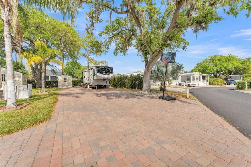 This large, deeded lot in beautiful Clermont, FL has it all! Park your RV on the extra wide and extra long paver pad and enjoy your own piece of Florida Living in sought-after Elite Resorts at Citrus Valley. Lot 9 is a perimeter lot located in a luxury section of the resort ("The Oaks") which is close to the clubhouse and backs up to a fence for lots of privacy. The shed provides extra storage and the mature oak tree offers shade. The lot has full hookups, ample parking and a grass area at the back of the lot for pets, a fire pit, etc. You have much more room than you'd expect on an RV lot, so there are tons of possibilities! This top quality resort is only 12 miles from Walt Disney World and offers many amenities including 2 resort bathhouses, laundry facilities, Bingo, a Veteran's Group, variety entertainment shows and social events. The lawn is cut regularly by the association and your HIGH SPEED INTERNET, cable, sewer, water and trash pick-up are all included in your quarterly Condo dues of $756. Low maintenance living, leaves you plenty of time to enjoy local attractions. You can call this beautiful property home in the Winter, or year round... Call today to set up your showing!