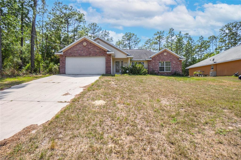 Photo of 11068 N Mataro Avenue, Citrus Springs, FL 34434 (MLS # OM707731)