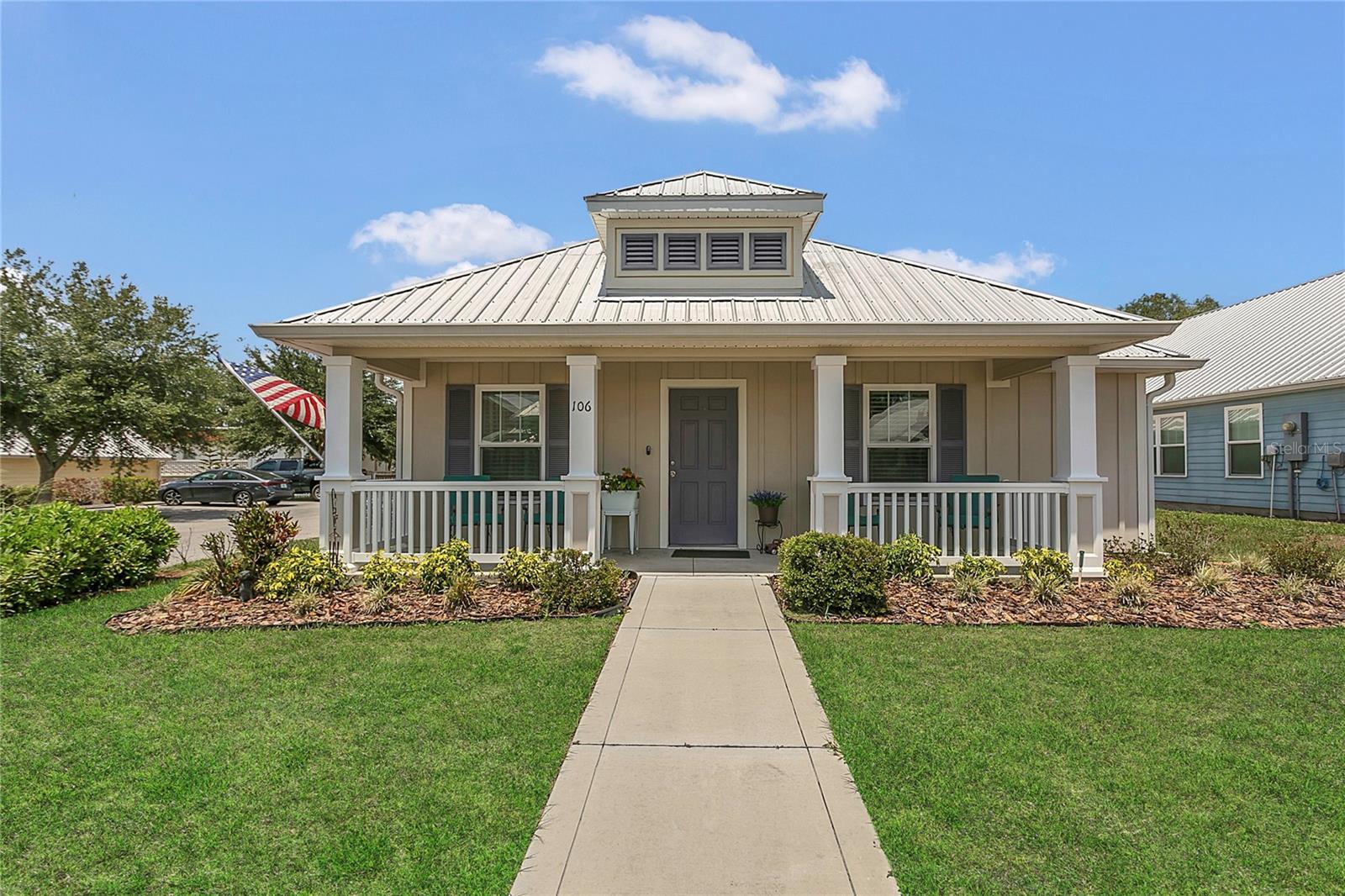 Charming Key West cottage-style home with inviting front porch in a quaint, quiet 55+ Active Neighborhood! Built in 2018, this home offers ADA accessibility, low-maintenance living, and is equipped with a durable metal roof built to last. Step inside and feel right at home in this light-filled, open-concept living space designed for comfort and connection. Windows line the living and dining areas, offering peaceful views of Lake Enola! The living room flows effortlessly into the dining area and kitchen, creating an ideal setup for everyday living or entertaining. The kitchen features stainless steel appliances, ample countertops, and cabinetry for plenty of storage. A breakfast bar with pendant lighting connects seamlessly to the dining space, offering a casual spot for gathering. Comfortable bedrooms & thoughtful bath design for everyday ease! Just off the primary bedroom, the primary bathroom features a large, walk-in shower equipped with safety grab bars and a wide vanity with extra counter space. The second bedroom provides a cozy space ideal for guests, a home office, or both. The adjacent second bathroom includes a shower/tub combo and built-in shelving for convenience. At the rear of the home, you'll find a dedicated laundry closet and an additional storage closet, great for anything you want easily accessible but neatly tucked away. Enjoy the ease of a private-access driveway that leads to a spacious one-car garage. Step onto the built-in rear deck, an ideal spot for grilling, relaxing, or soaking in the sunshine. Set in a peaceful, friendly neighborhood with manicured lawns, this home is part of a tight-knit community where pride of ownership shines. One of its standout features is the private community dock overlooking Lake Enola. With just 13 homes in the community, you'll enjoy the best of Florida living in a quiet, hidden gem of a neighborhood. Call us today for a private showing!