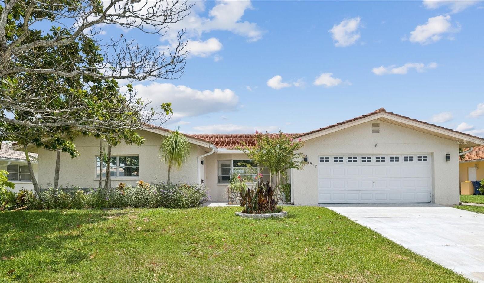 One or more photo(s) has been virtually staged. Boating enthusiasts come discover and enjoy the amazing waterfront community of Gulf Harbors! This newly renovated home is located on a spacious lot with 2 bedrooms, 2 full bathrooms and 1 half bathroom and a 2-car garage. The home features direct water access on the canal leading out to the Gulf for all your water enjoyment. Anclote key is approximately 3 miles away and only accessible by water. The home sits on a quiet cul-de-sac. Upon entering the home, you will find a spacious living room with a bay window looking out to the west great for viewing the setting sun. The family room and kitchen combination area are to the rear of the home. Beautiful tile flooring graces the home throughout the living, dining and kitchen area of the home. The kitchen has new appliances with all the modern conveniences, breakfast bar, plenty of cabinets, closet pantry and a skylight for additional natural light. The family room overlooks the water with views of the large backyard big enough to make outside living dreams come true. The primary bedroom includes a walk-in closet, ensuite bathroom and private entry to the lanai. The enclosed lanai spans the back of the home. Water features include an 8X12 floating dock and a stationary dock with 10,000 lb lift. The Gulf Harbors community offers a private member only beach with an annual fee of $200. The community Civic Association is optional to join at $125/yr
