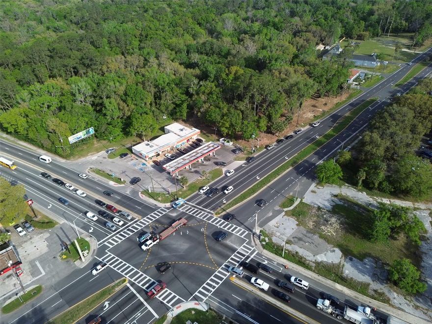 This sounds like a very promising piece of real estate in a highly desirable location! The proximity to the University of Florida and UF Health facilities significantly increases its value and potential for various developments.

The U7 zoning in the City of Gainesville offers a wide range of possibilities, making it attractive to different types of investors and developers. The permitted uses you mentioned (multifamily, commercial, QSR, hotels/motels, medical offices) cover a broad spectrum of potential revenue-generating projects.

The unique feature of having access roads at both the front and the back is a significant advantage. This could indeed facilitate better traffic flow and open up creative design options for any future development on the lot. The fact that it was previously approved for a Comfort Suites hotel in 2007 also indicates that the site has been considered suitable for hospitality purposes in the past.

Finally, the existing leased billboard structure provides an immediate stream of income, which is a definite plus for any potential buyer or developer.

Without the attachment, I can only comment on the information you've provided. If you have any specific questions about this property, such as potential valuation, zoning regulations in more detail, or comparisons to other properties, please feel free to ask!