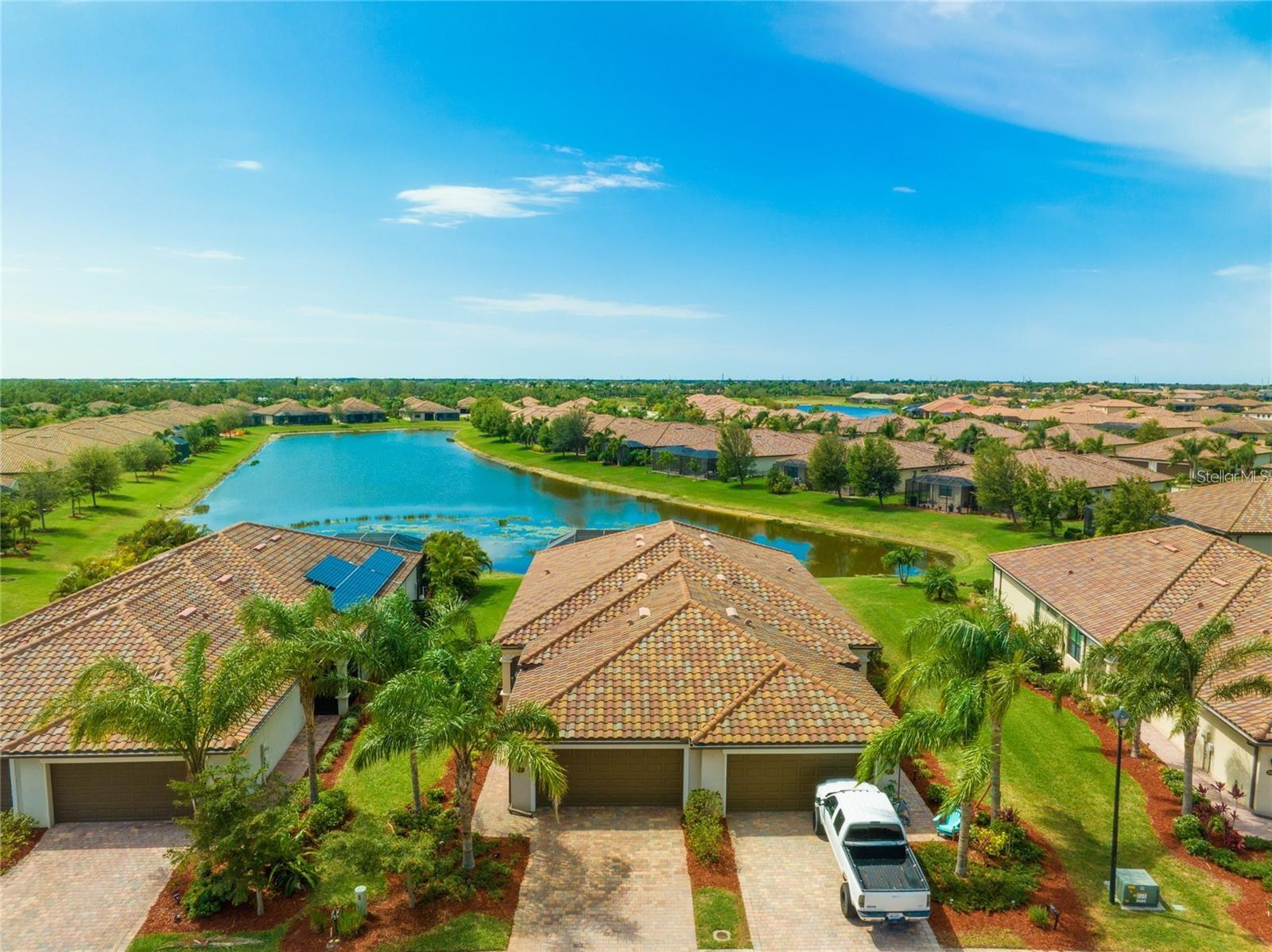 Annual or long term TURNKEY perfectly furnished 2 bedroom and den/villa on awesome water lot with an expansive lanai in Grand Paradiso which is a maintenance-free, gated community. You can join in a community group activity, relax at the resort-style pool, or just enjoy the water view from your own comfortably furnished huge expanded lanai with covered and uncovered area. The main bedroom with direct slider walk out to the lanai is split from the other rooms. The kitchen is open to the living area that has a slider to walk out to the lanai. You will appreciate the extremely clean 2 car attached garage. This resort community is packed with amenities! Including a excellent swimming pool, spa, tennis courts, pickle ball courts, fitness trails, game room with billiards and card tables, a craft room with space designated for a kiln, a vast fitness center and clubhouse locker rooms including saunas and steam rooms, poolside cabanas and other special interest clubs to join. Lawn and landscape maintenance, basic cable and internet are included in the rent. Excellent proximity to the renowned beaches of Sarasota County, nearby championship golf courses, world-class shopping, fine restaurants and cultural events. Prefer an annual lease and will entertain a shorter time period. Pets are possible on a case by case basis. First and last month rent and security deposit required.