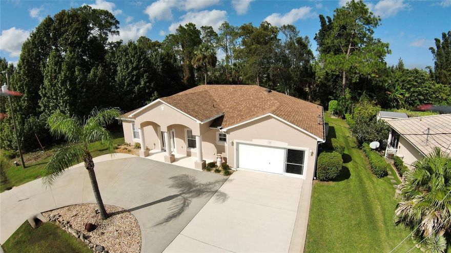 Spacious home. Formal Dining Room. Eat in kitchen with large pantry. Kitchen island overlooking family room, with built in shelving .  Sliders leading out to open patio.  Master suite with walk -in closet. Master bath features walk-in shower and garden tub. 4 th bedroom can also be used as office. Ceiling fans. Front entrance with covered porch. Circular driveway. Garage door with screening.  New Roof 2022, sun tubes. Shed for extra storage.