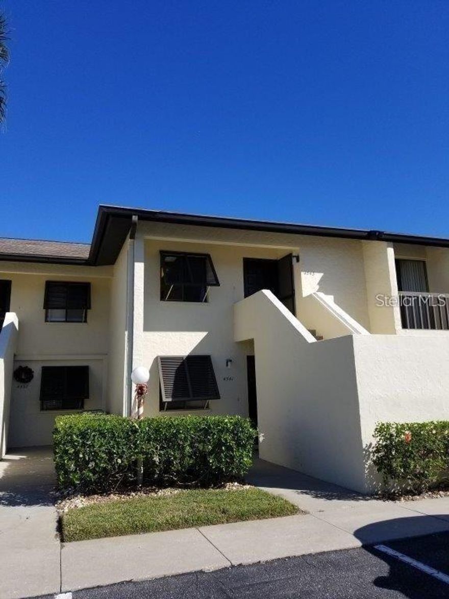 This second-floor, two-bedroom, two-bathroom rental unit comes fully furnished and is available for an annual lease (12 months). Enjoy stunning views of the golf course and pool from your screened lanai. The kitchen features a built-in desk for additional workspace. Longwater Chase includes two heated pools and assigned parking with a storage closet.  The Meadows community boasts over 14 miles of walking and biking trails, fishing spots, 15 Har-Tru tennis courts (membership required), 10 pickleball courts, a playground, beautiful gardens, basketball court, three pristine golf courses, a junior Olympic pool, and a fitness center. You’ll also find a variety of restaurants and shopping options just minutes away from the Mall at UTC, downtown Sarasota, and I-75. Annual residents get to enjoy this wealth of amenities included in the rent price, along with a calendar of monthly community events. Tennis and golf are available with separate fees. Please be aware of vehicle restrictions set by the association, which prohibit overnight parking for trucks and commercial vehicles. The unit includes one assigned parking spot, with additional guest parking. Conveniently located to Meadows Village Shops, residents have access to dining, a spa, massage services, and medical offices. This rental is intended exclusively for long-term occupancy (not available for seasonal or short-term rentals), and no pets are allowed per association rules. Rent is $1890 per month, with a deposit equal to one month’s rent. Tenant application fees and approval are required, involving a two-step application process. Tenants will be responsible for water, electricity, and Wi-Fi. The landlord reserves the right to require all tenants to obtain renter’s insurance.