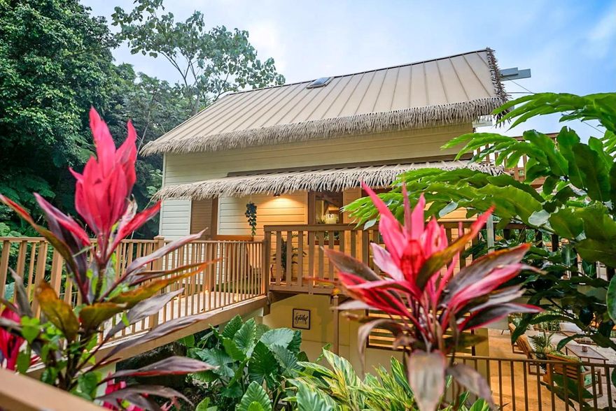 Experience the magic of Casa Bali, a luxurious 5-bedroom, 6-bath residence nestled within the lush El Yunque Rainforest. Perfectly situated on a quiet cul-de-sac for maximum privacy, this tropical sanctuary offers two pools, expansive open-concept living areas, and breathtaking ocean and rainforest views from the upper balcony. Each bedroom features its own ensuite bathroom, blending comfort and sophistication. A serene waterfall behind the home fills the air with the soothing sounds of nature and flowing water. The property includes a full backup generator and is currently rented long-term until 2027, with the lease to be honored by the new owner. Surrounded by nature yet designed for modern living, Casa Bali is a true paradise retreat. Schedule your private viewing today!..