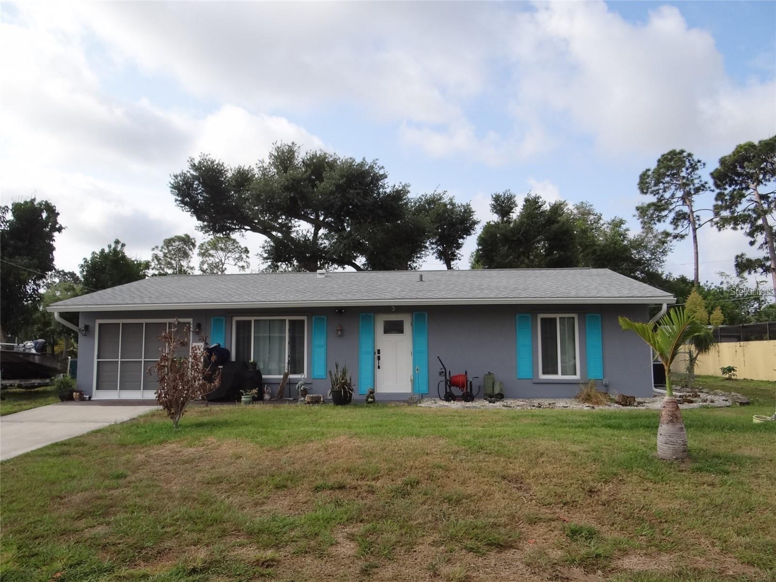 NICE Port Charlotte Home for ANNUAL Rent! Available to start! Large living room! Wonderfully updated kitchen with granite counter tops and stainless steel appliances. Updated bathrooms! Walk in showers! Large laundry room with room to fold and hang your clothes! Plus a utility sink!
This home is a 2 bedroom, 2 bathroom, 1 car garage (auto garage door opener) with a fenced yard, screened lanai and 1 shed. Plenty of room inside with the living room and large enclosed family room with barn doors. Really fresh and clean. A must see