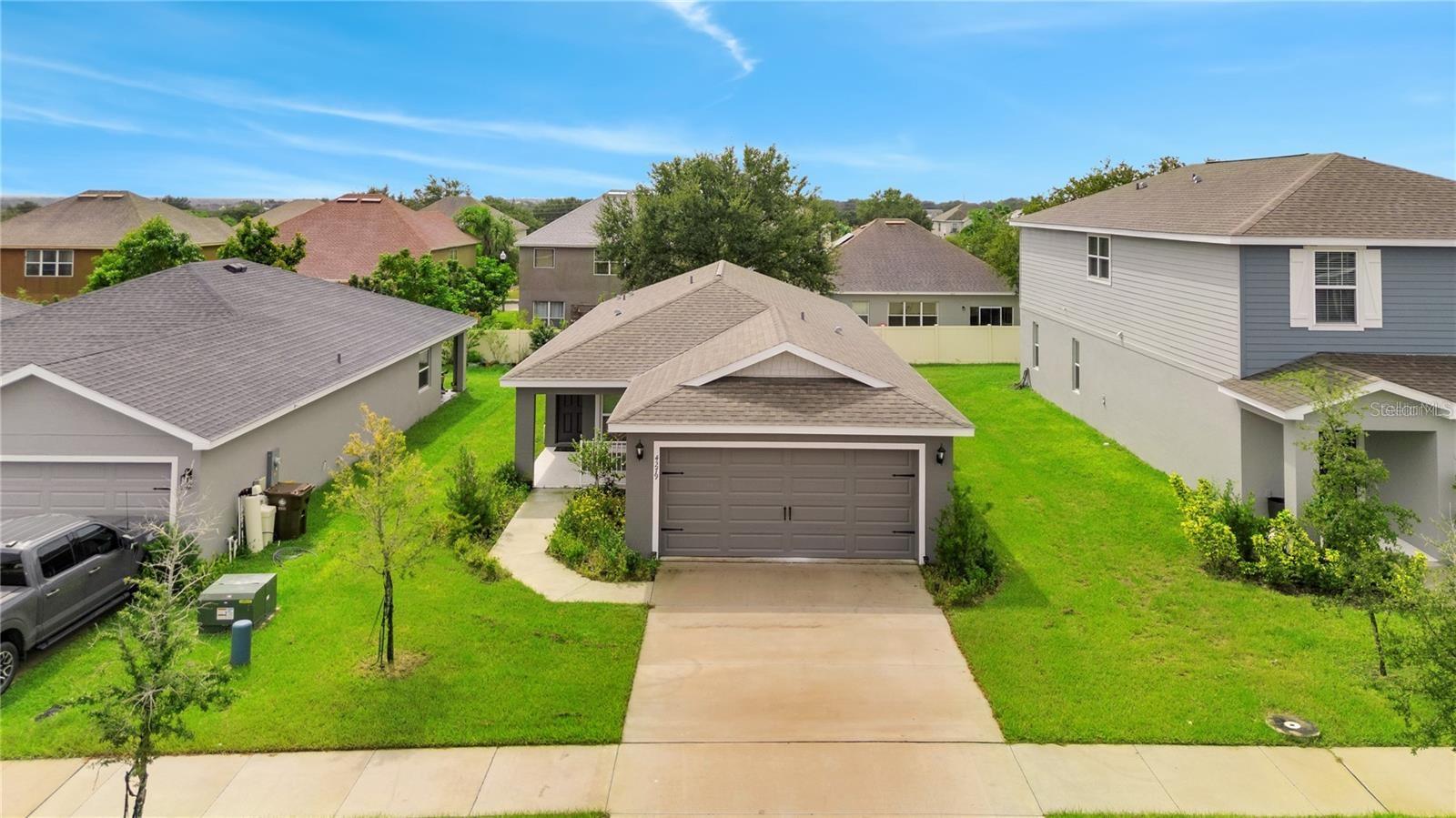 Available now! This beautiful 3BR/2BA home, built in 2022, features a modern design with an open floor plan. The kitchen offers granite countertops and stainless steel appliances. Vinyl flooring runs throughout, with carpet in the bedrooms. Washer and dryer included. Located in a growing area near Champions Gate and Disney. Enjoy community amenities including a large park with play area and centralized mailboxes. Lawn care included. Schedule your showing today!