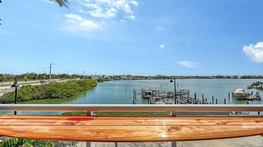 VIEWS, VIEWS, VIEWS, & MORE VIEWS! If you're looking for great waterfront views or are a boater either, this is the home for you! Beautifully updated with unbelievable views of Dona Bay, this waterfront condo is the perfect combination of (did I say views?), Dona Bay, Intercoastal Waterway, & Gulf access. Looking over Dona Bay, which leads directly to the Gulf, is the huge covered front porch, kitchen, living, & dining rooms. You'll love having your boat only steps away ready to launch from your deeded dock with 10,000 pound, recently installed lift. The home also has two deeded parking spots in the enclosed, first floor garage with private elevator access into this home. Listed to sell quickly, this waterfront home is unbelievably nice & will absolutely overwhelm you. CAll before it's gone for your own private showing.