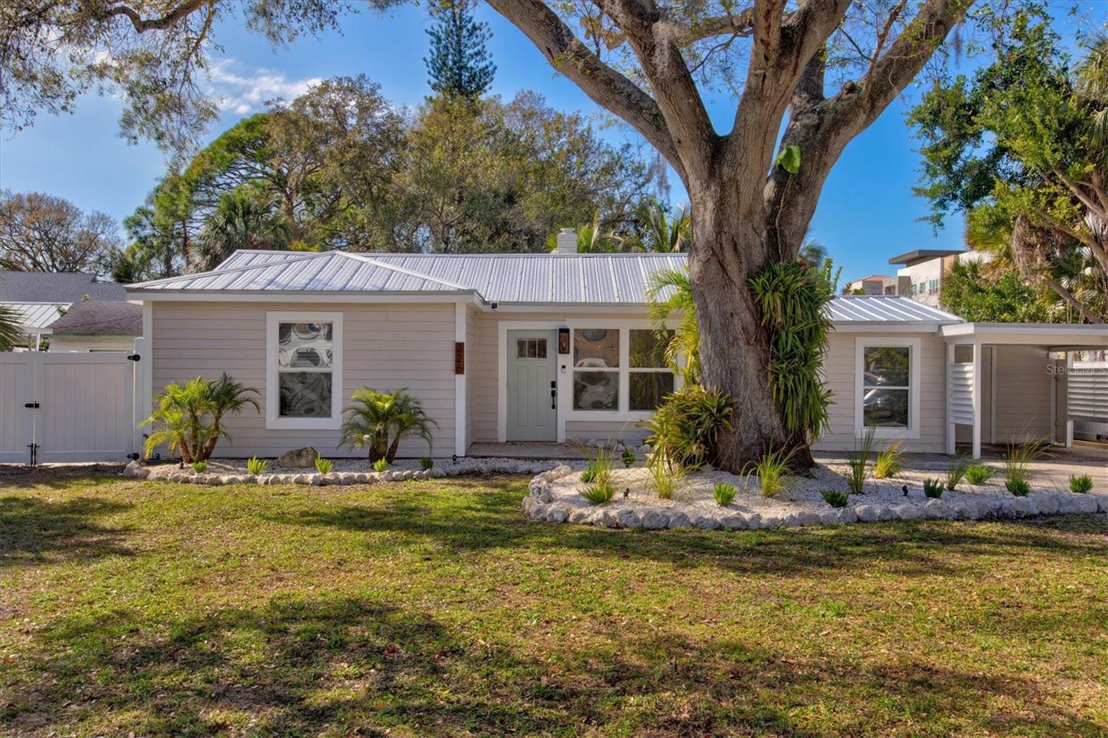 Welcome to Casa Limon! A freshly renovated designer pool home with tons of natural light, a coastal contemporary vibe, & a location that is walkable to Downtown Sarasota, Payne Park, & the Legacy Bike Trail. Comfortable for groups of up to 8 people featuring 4 beds, 2 baths, a heated pebble pool, open floor plan, inside laundry, chef's kitchen, dedicated work space, fenced yard w/ tropical landscaping & all of the luxury touches you'd find in a boutique hotel but in a private cottage setting.
****Please note the outdoor kitchen area is currently under construction and will be completed on or before March 1st. The photos will be updated at that time with new photos that show the outdoor kitchen, furniture, uplighting and some other accessories not yet shown in the photos.
Upon entering the home using your assigned unique access code on the front door keypad you will be welcomed by all of the open space and natural light that floods this house. A foyer area with hooks for your bags and keys is immediately to your left. Directly in front of the foyer is the designer kitchen with stainless steel appliances and breakfast bar. To your right is a coastal contemporary dining table with 6 chairs but room for 8 if needed. The dining area can be closed off from the adjacent 4th bedroom/flex room utilizing the newly installed custom barn doors. The flex room is a slightly sunken room (4 inches below the dining room) and can be utilized as a 4th bedroom with pullout queen sleeper, a TV room or a kids hangout room. The stackable washer and dryer and supplies can be found in the closet in this flex space. Beyond the kitchen is the large open living room with 65 inch Smart TV which offers streaming services that include Amazon Video, Netflix, Hulu, ESPN+ and Disney+. The living room offers seating for up to 6 people as well as a work station that allows you to remain in the conversation. Access to the private fenced backyard, outdoor kitchen and pool can be found from this room. Next to the living room is the Master Suite which offers a King bed, private ensuite bath with double vanity sinks and walk-in shower, ample closet space and separate private access to the pool and lanai along with an entire wall of Western facing windows to watch the sunsets. On the South wing of the house are two additional bedrooms with a shared designer bathroom with walk-in shower. The front bedroom offers a King bed and the back bedroom offers a twin bed with pullout trundle. Both bedrooms offer closet space, nightstands and a dresser. The newly fenced backyard faces West and offers a heated Pebble Pool, Tropical landscaping with uplighting at night, an outdoor kitchen area with bar seating and flat screen TV to watch the games, Lounge chairs and a conversation area.
Guest access
You will have free rein of the entire property during your stay other than one locked owner's closet just inside the front door and the outside area behind the carport which will remain locked.