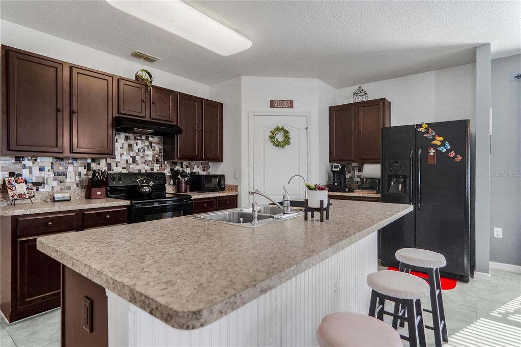 Photo of 521 Nova Drive, Davenport, FL 33837 (MLS # O6374707)