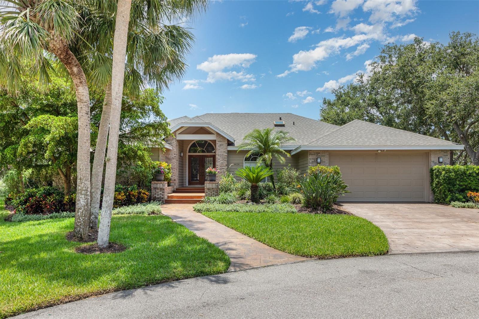 Welcome to this charming 4-bedroom, 3-bath custom home located at the end of a quiet cul-de-sac in one of Sarasota’s most desirable neighborhoods. Enjoy stunning lake views and partial ownership of a nearby private island—your slice of paradise!
Inside, the home offers a flexible layout with separate living, dining, and family rooms. The updated kitchen features granite countertops, wood cabinetry, a walk-in pantry, a built-in desk, and a sunny breakfast room. The spacious master suite boasts a custom walk-in closet and a luxurious bath, complete with a garden tub, a walk-in shower, and a private outdoor garden space.
The second and third bedrooms each have cozy lofts with ladders, while the fourth bedroom, ideal for guests or a home office, features a large walk-in closet and private bath access. The oversized utility room provides additional space for work or hobbies.
Step outside to a true retreat with a resurfaced pool deck, built-in outdoor kitchen, and hot tub overlooking the lake. With both covered and open-air entertaining areas, this home is perfect for enjoying Florida living at its best.