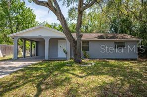Move-in with $3400! Apply today - move in tomorrow! Only First Months Rent plus Security Deposit to Move-in. DOGS/CATS OK!! LARGE FENCED YARD! LOOKING FOR A RENTAL WHERE YOU CAN PARK A BOAT/RV/WORK TRUCK with TONS OF PRIVACY, NATURE and FENCED YARD? You found it!! 2 Bedroom, 1 Bath, Living Room, Family Room (can be a 3rd room), Laundry Room inside off kitchen, 1 Car Carport, 940 square feet plus the carport. If you love nature and privacy, you really can't believe how quiet this area is and that you are looking at nature on all 4 sides. Beautiful Open View out the front Window! Almost directly across from Waters Edge and the 1st Street in on a beautiful Paved Road with every property on a huge piece of land. There is a double gate on left of home where you can park your boat/rv/work truck or other things with ease. Home is on a Well with Septic, so no water bill!! This home has a New Port Richey address, but, it's on the North side of NPR and very close to Hudson SR 52 area that can head right out to the Suncoast Parkway to commute to work, or to the local Hudson beach. Feel like your in the country, but, then, jump right out onto the main road, and everything you need is just a couple of miles, shopping, restaurants, and fun. 1st Months Rent plus Security Deposit to move-in. Lease Annually or Option to Purchase available.