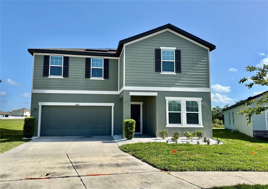 **Welcome to 35657 Buttonweed Trail, a stunning 2022-built Starlight Homes Galileo floor plan offering 5 bedrooms, 3 bathrooms, and 2,732 sq ft of beautifully updated living space in the sought-after Hidden Creek community of Zephyrhills — ideally positioned just minutes from Wesley Chapel, one of Tampa Bay's fastest-growing and most desirable corridors.** This move-in ready two-story home has been completely refreshed with fresh interior paint throughout, brand new luxury vinyl plank flooring, and plush new carpet in all bedrooms. The open-concept kitchen features a large island, white shaker cabinets with crown molding, and brand new stainless steel Samsung appliances — all flowing seamlessly into the dining and living areas. A full bedroom and bathroom on the first floor make this layout ideal for mother and law, guests or multi-generational living, while upstairs you'll find four spacious bedrooms, including a massive 19x14 primary suite with a 72-inch vanity, walk-in shower, and a nearly 95 sq ft walk-in closet. The second full bathroom boasts a generous 60-inch vanity, and the oversized loft is perfect for a playroom, media room, or second living area. Step outside to your large backyard with peaceful pond and conservation views — no rear neighbors, just pure Florida serenity. Residents enjoy resort-style community amenities including a pool, cabana, tot lot, and dog park. This home also features a fully operational solar panel system installed in May 2023 — buyers may assume the existing loan at just $261.87/month with no transfer fee, negotiate a seller-paid buyout, or explore system removal — ask your agent for the full solar package and details. Located with unbeatable access to major highways including I-75, I-275, and I-4, and just minutes from the SR-54 and SR-56 corridors, Wiregrass Mall, Tampa Premium Outlets, The Grove at Wesley Chapel, AdventHealth, top-rated schools, premier dining, and endless shopping — with Tampa International Airport, Downtown Tampa, and the stunning Gulf beaches all within approximately one hour. As an added bonus, the seller is willing to contribute towards closing costs, prepaids, or an interest rate buydown, plus a home warranty up to $600 — making this an incredible opportunity for any buyer ready to move with confidence. Schedule your private showing today and experience everything this beautiful home and community have to offer — comfort, style, convenience, and location all in one place. This home truly has it all.