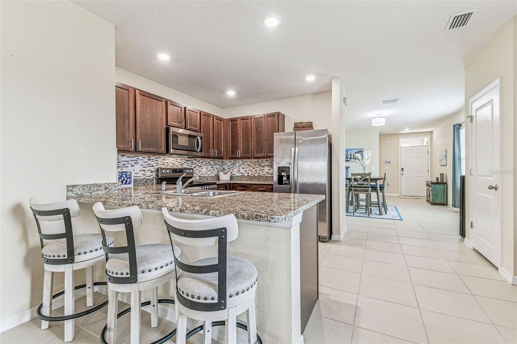 Photo of 1398 Crescent Hoop Way, Wesley Chapel, FL 33543 (MLS # TB8419339)