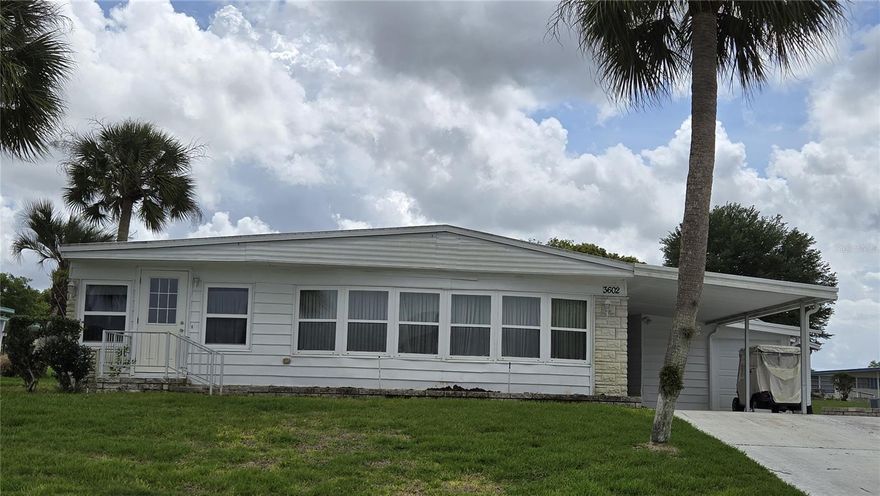 2-Bedroom 2 Bath home in Zellwood Station has large outside storage area, laundry and golf cart garage. This house has been replumbed, insulated windows, and Membrane roof installed in 2022.  Large living room has beautiful windows that allow tons of natural light.  There is a Florida room off the main living room that can be used as an office or extra living space. Some TLC will make this house something special! Zellwood Station is a Resident Owned 55+ Golfing Community located between Apopka and Mt Dora.  We have a 72 Par golf course, 4 pools, pickleball and tennis courts; water exercise and line dancing classes and our own Whistle Stop Restaurant and Lounge with banquet facilities.  There is always something to do here.  Close to the 429 for easy access to airports and attractions, we are close to shopping, restaurants, medical facilities and churches.  Come and see what we have to offer!