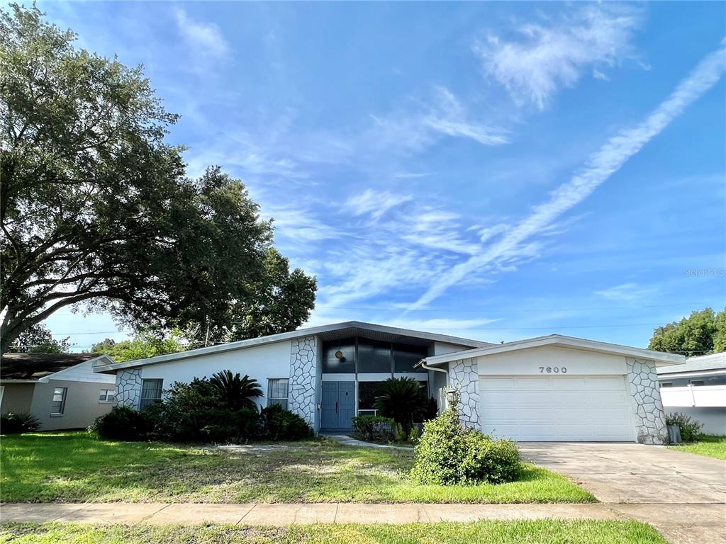 ***BACK ON THE MARKET with Recent Updates: Freshly Painted Interior Walls; Fixes Made to the Exterior of the Chimney on the Roof. *** BRAND NEW ROOF installed December 2022. *** Step back in time in this 1960's MID-CENTURY MODERN RANCH home that is truly a gem of a find. This 4 bed, 2 bath home features a lot of character including a VAULTED CEILING in the living room, original TERRAZO flooring in all bedrooms and bathrooms! It has an oversized family room with a WOOD BURNING FIREPLACE. The living room has floor to ceiling windows that showcase the true charm of the home and let in a huge amount natural light. Home features include a screened-in enclosed back porch, a spacious yard with endless potential, and an oversized 2 car garage. Centrally located in ORLANDO EAST, this home has quick access to different parts of the city and is zoned for desirable Winter Park High School. Don't wait for your chance to see it!