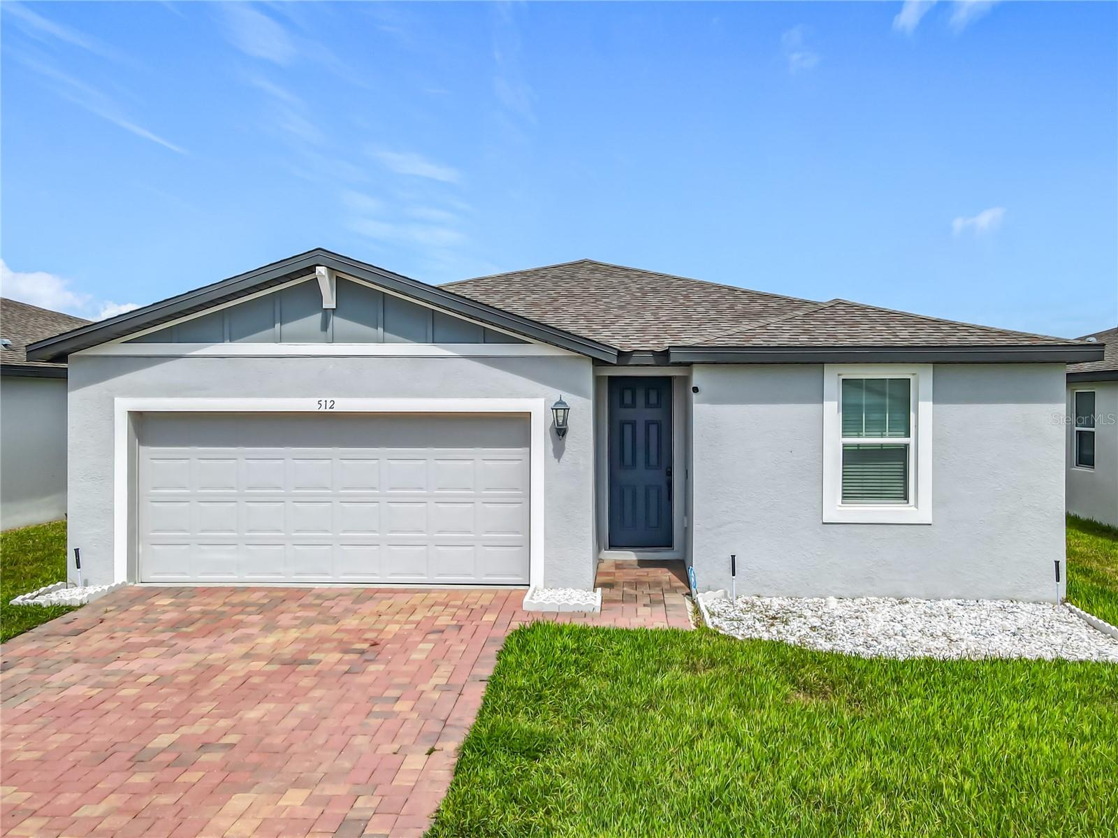 Nestled in a peaceful and growing neighborhood in Winter Haven, this beautifully maintained home offers a thoughtful split floor plan that separates the primary suite from the additional bedrooms, providing comfort and privacy. The kitchen features granite countertops, shaker cabinetry, and stainless steel appliances, all flowing into a spacious living and dining area with accent walls and plenty of natural light. The primary suite includes a walk-in closet and a dual-sink vanity in the bathroom, while the additional bedrooms are located on the opposite side of the home with a shared full bathroom. The laundry room includes additional storage and leads to the two-car garage. The backyard offers a clean slate for outdoor living, with space to entertain or relax. Conveniently located just minutes from grocery stores, restaurants, and Highway 27, with easy access to schools, downtown Winter Haven, Haines City, and Lakeland. This move-in-ready home combines location, comfort, and value—schedule your showing today.