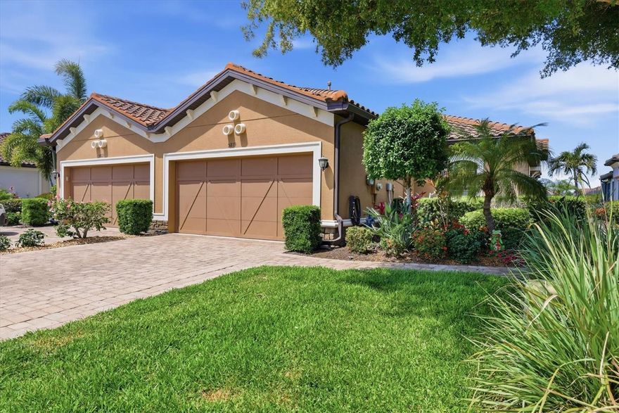 Welcome to one of the most beautiful villas in Esplanade by Siesta Key—a professionally decorated two-bedroom, two-bath residence, plus a den, that offers the perfect blend of luxury, comfort and maintenance-free living, including roof care and exterior painting every five years. Elegant details include tray ceilings, crown molding, and high-end laminate floors in the bedrooms paired with pristine tile throughout. The gourmet kitchen features new quartz countertops and backsplash, wood cabinetry, stainless steel appliances, and updated designer light fixtures in dining room and above breakfast bar. The dining and living areas create an inviting space to entertain and enjoy the breathtaking water views. Step through the sliding glass doors into the generous screened-in lanai, where you can relax and enjoy watching a variety of birds fly over the peaceful lake views right in your backyard. The gas barbeque makes alfresco dining a breeze. The spacious owners’ suite offers a large walk-in closet with professionally designed custom cabinetry. The ensuite bathroom features a dual-sink granite vanity along with a walk-in shower and built-in bench. Designed with privacy in mind, the second bedroom and en-suite bathroom is generously sized and well-appointed with quality finishes and new ceiling fans. The den provides the perfect space for a home office, library, reading room, or guest quarters. The laundry room offers new cabinets and utility sink. The garage has been upgraded with custom organizers and overhead metal racks. Additional upgrades include hurricane shutters, a widened driveway and an extended paver walkway. Residents of Esplanade by Siesta Key enjoy social activities and resort-style amenities, including an elegant clubhouse, lagoon pool and spa, fully equipped fitness center, Har-Tru tennis court, pickleball court, bocce court, and a dog park. With Siesta Key and downtown Sarasota just minutes away, this superb community offers the best of Florida’s tropical lifestyle. Furniture is optional.
