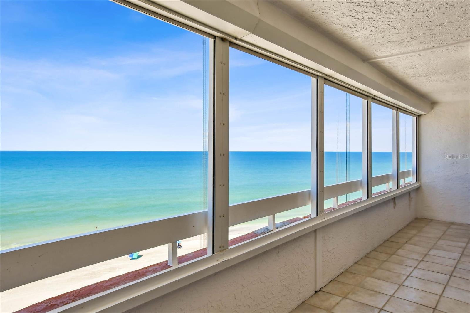 ***One or more photos virtually staged***
Gulf-Front Corner Unit Condo with Panoramic Views l Redington Shores, FL
Welcome to your slice of paradise on the 12th floor of a coveted Gulf-front building in beautiful Redington Shores! This rarely available 2-bedroom, 2-bath corner unit is the perfect blend of luxury, comfort, and breathtaking scenery. With unobstructed views of the Gulf, the Intracoastal Waterway, and the sparkling city lights, this home offers an unparalleled coastal living experience.
A private front balcony off the kitchen provides a peaceful spot to enjoy your morning coffee with views of the Intracoastal and stunning sunrises. Step inside and be immediately captivated by the expansive wraparound balcony-a true showstopper-offering front-row seats to golden Gulf sunsets.
The open-concept living and dining area is wrapped in windows, bathing the space in natural light and showcasing sweeping water views from every angle. The kitchen features granite countertops, wood cabinetry, wine cooler, and a layout ideal for entertaining.
The master suite is a serene retreat featuring an ensuite bath and walk-in closet, complete with sliding doors by Andersen that open directly to the Gulf-front balcony. Fall asleep to the sound of waves and wake up to endless blue horizons. The second bedroom also boasts a walk-in closet, built-in safe and private access to the 2nd bathroom-ideal for guests.
The home is equipped with powered hurricane shutters, a new A/C system (2025), automated window shades (2025) and smart home features like security cameras and an Ecobee thermostat for peace of mind and comfort year-round.
Additionally, two assigned parking spaces in the lower level garage and a private storage unit on the ground floor add to the ease of ownership. The community features a year-round heated pool, private beach access, and 24/7 security amongst other amenities.
Don't miss this rare opportunity to own a premium corner unit in one of the most desirable beach communities of the Florida Gulf Coast. Whether you're looking for a full-time residence, vacation getaway, or investment property-this condo checks every box.
Offered in Redington Shores, Florida - where everyday feels like a beach vacation.
Schedule your private showing today! This gem won't last long.