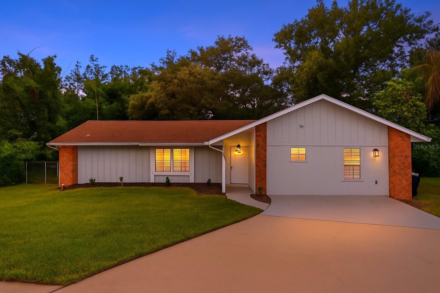 Located in the sought-after neighborhood of Queenswood Manor in Orlando, this fully renovated 4-bedroom, 3-bathroom home offers 1,960 square feet of living space on a spacious .25-acre fenced-in lot. A standout feature is the private in-law suite with its own entrance, kitchen, bedroom, and bathroom that is perfect for multigenerational living or rental income. From the moment you arrive, you’ll appreciate the gorgeous curb appeal and manicured landscaping. Inside, brand-new luxury vinyl plank flooring flows throughout. The modern kitchen features stainless steel appliances, quartz countertops, and updated finishes. The bedrooms are bright and comfortable with large windows and ceiling fans, while the bathrooms are refreshed with contemporary vanities and tile-lined showers. A sliding glass door opens to the back porch overlooking the expansive backyard, ideal for gatherings or relaxing at sunset. Living in Orlando means enjoying world-class entertainment, theme parks, a diverse dining scene, shopping destinations, beautiful lakes, and convenient access to major highways, downtown, and the Orlando International Airport.
